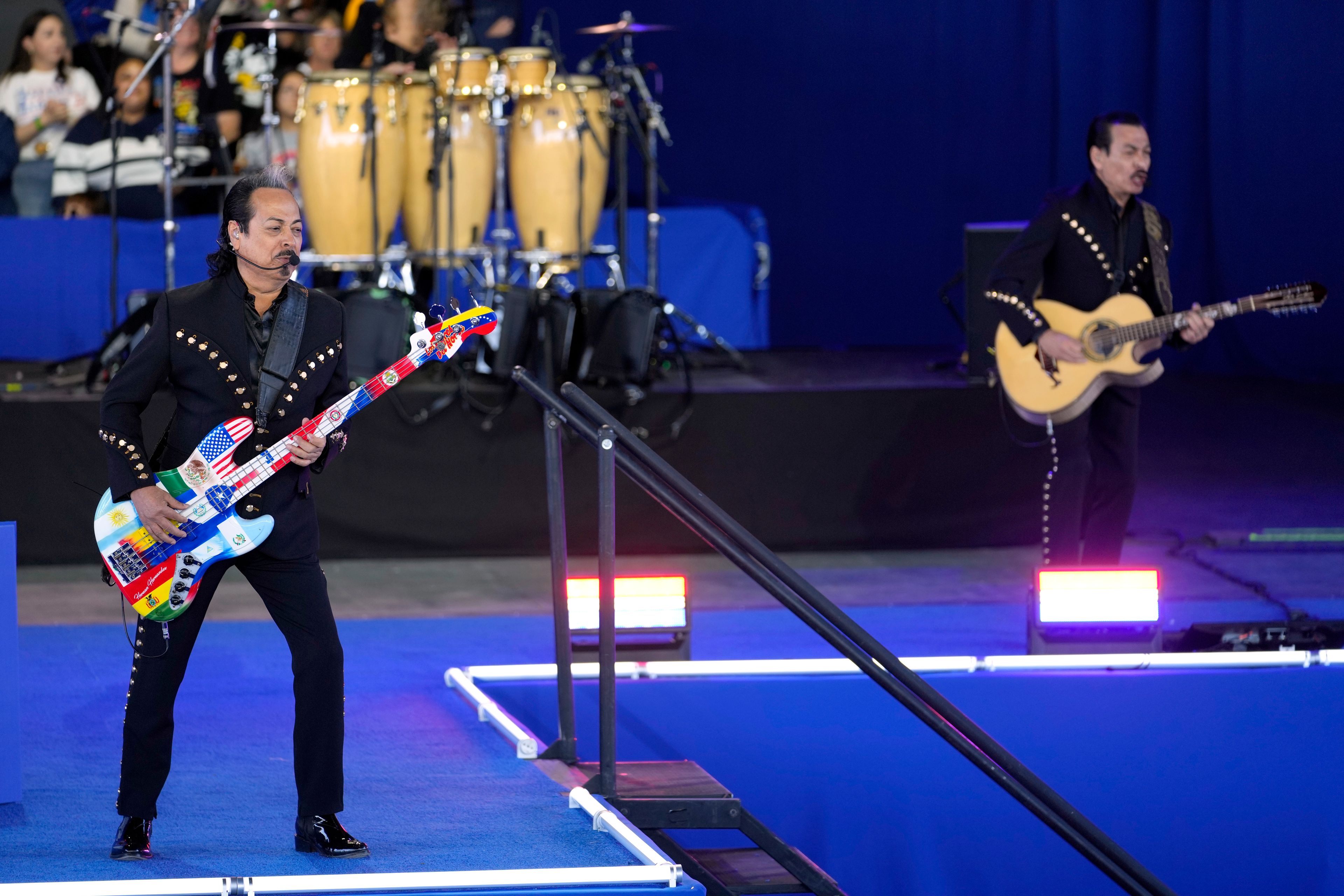 Musical group Los Tigres del Norte perform at a campaign event for Democratic presidential nominee Vice President Kamala Harris at Talking Stick Resort Amphitheatre, Thursday, Oct. 31, 2024, in Phoenix. (AP Photo/Matt York)