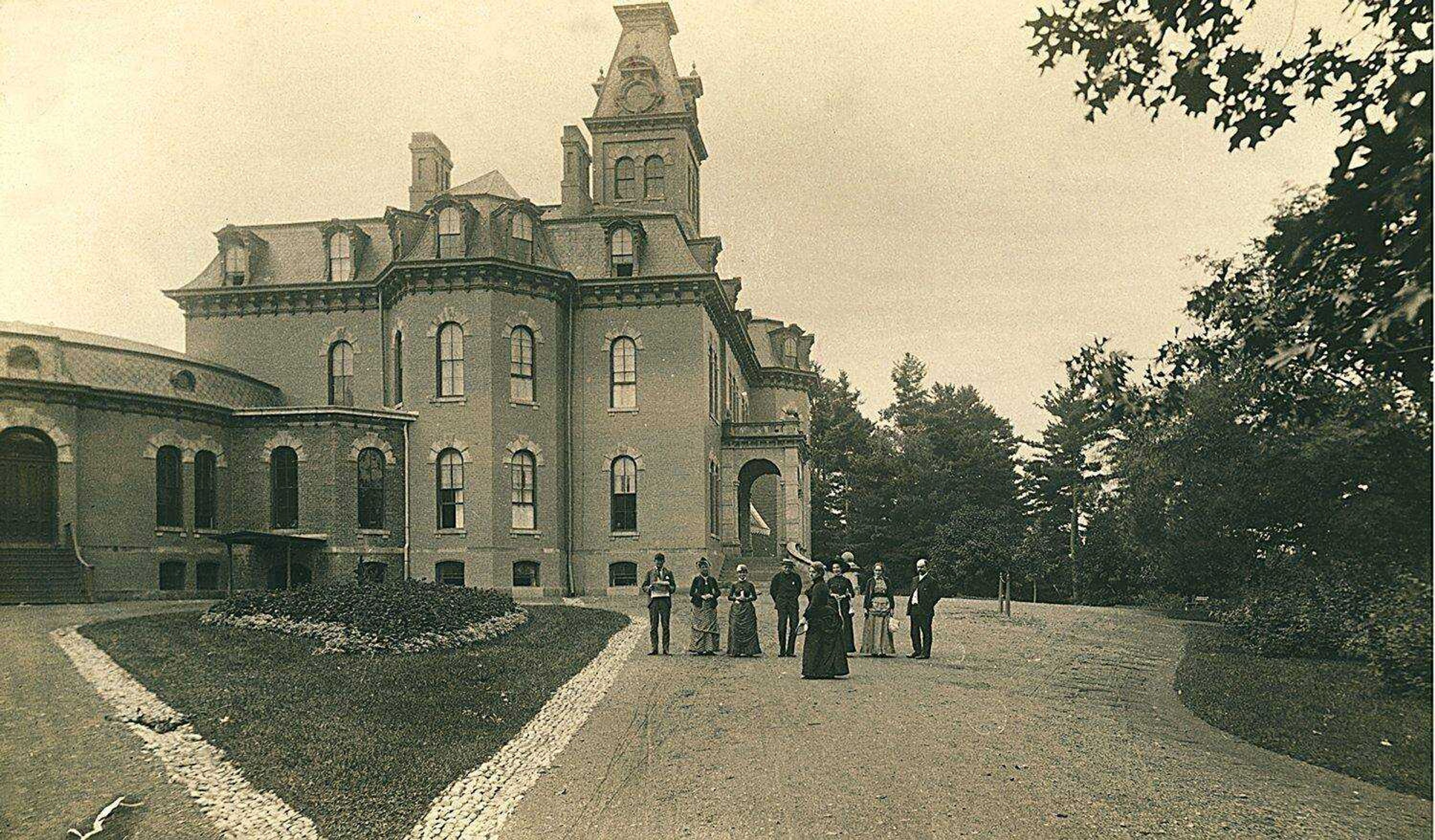 New York Public Library (This photo, made in the 1880s, showed staff members in front of the Willard Psychiatric Center, formerly known as  the Willard Asylum for the Insane in the Finger Lakes region of New York. An exhibit at the New York Public Library's  science, industry and business branch on Madison Avenue,  "The Lives They Left Behind: Suitcases From a State Hospital Attic," has on display suitcases that were stored in an attack of the hospital, brought by patients who spent decades at the institution for the incurably insane.)