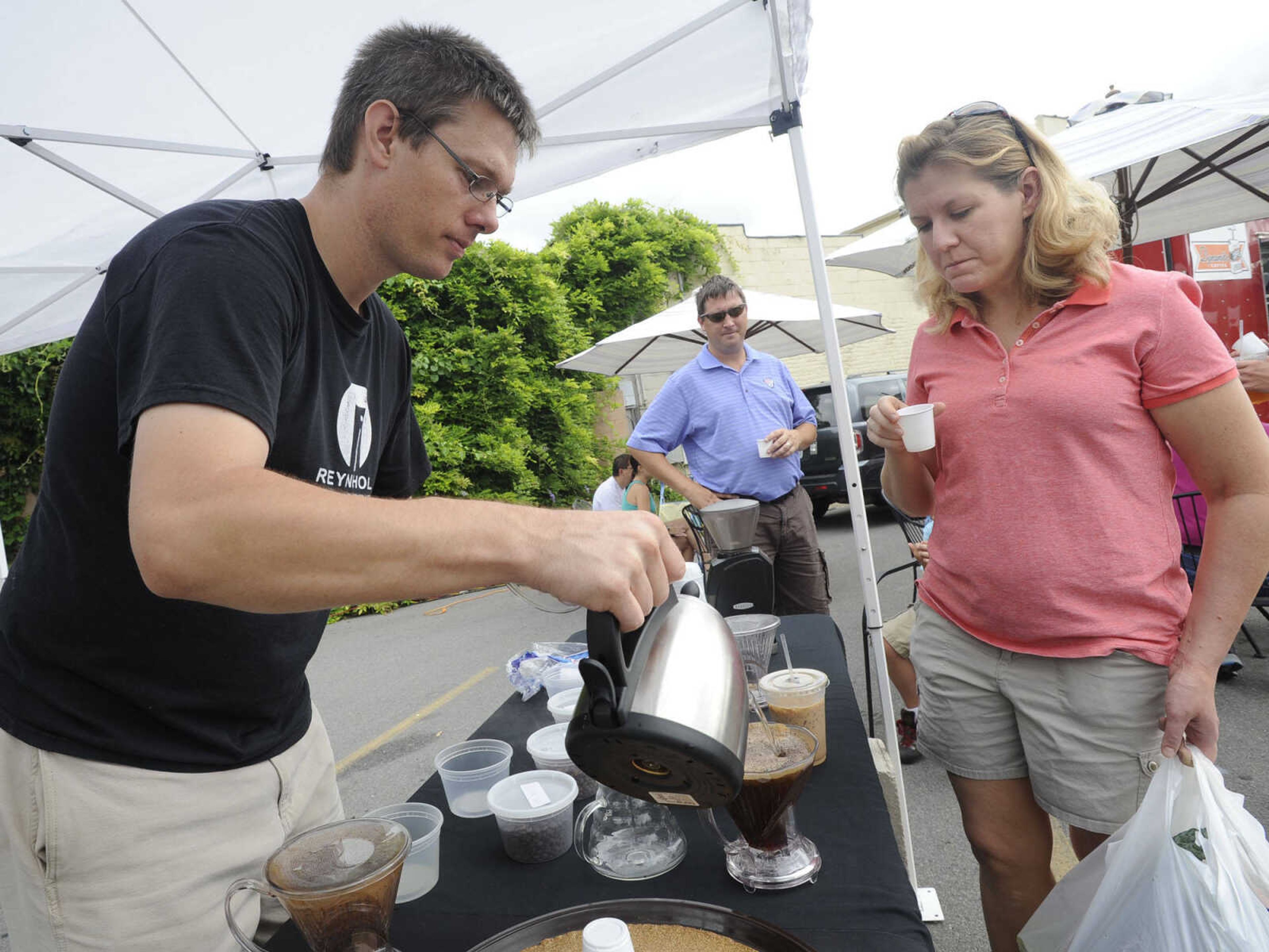 DeWayne Schaaf, owner of Kaleidoscope Coffee, brews coffee in a demonstration for Carol Thiele Saturday, July 6, 2013 at the Cape Riverfront Market in Cape Girardeau.