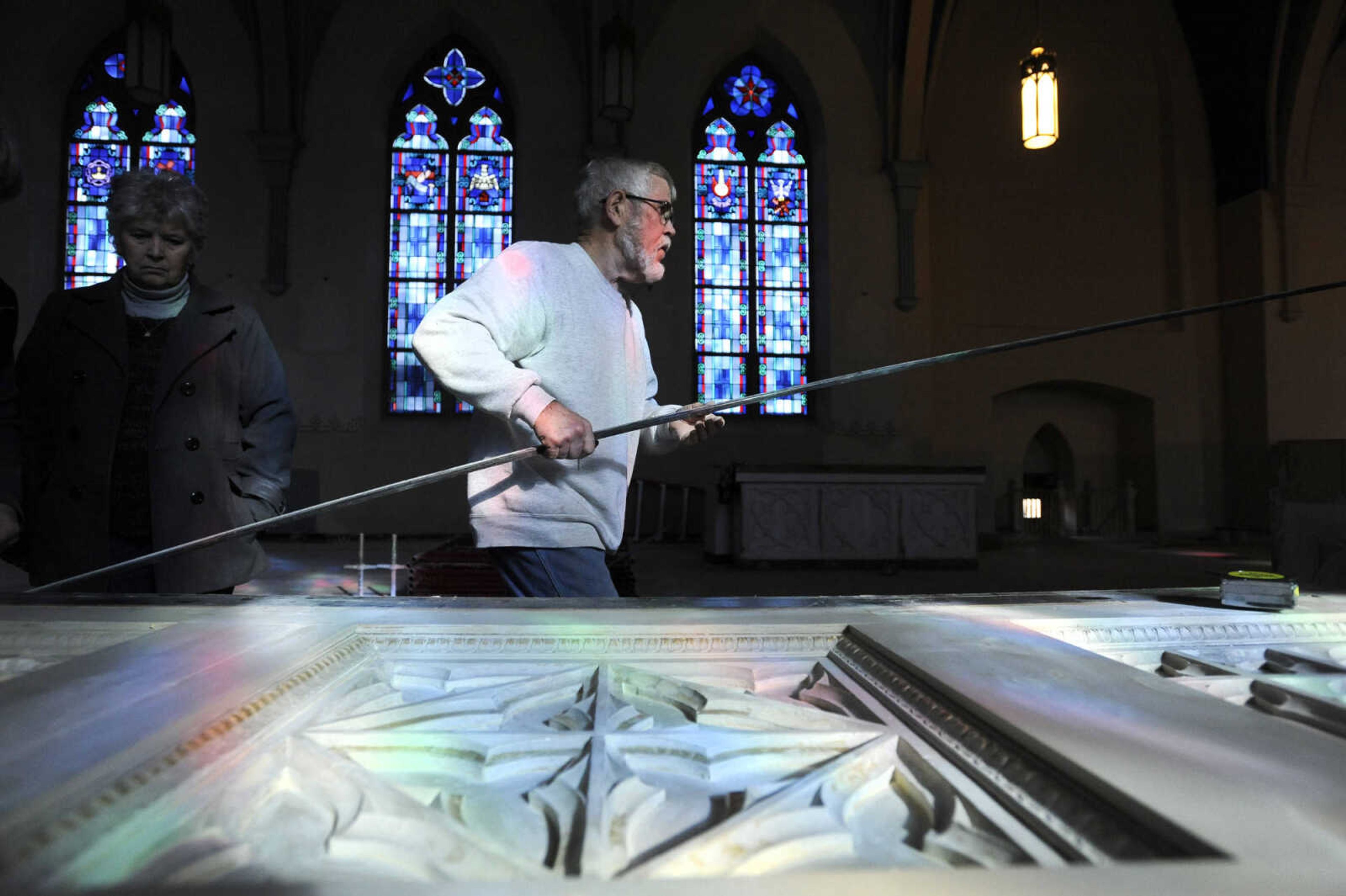 LAURA SIMON ~ lsimon@semissourian.com

Nick Elfrink works on figuring out the repairs to the base of an altar inside St. John's Catholic Church in Leopold, Missouri on Feb. 11, 2016. Elfrink and his wife Geri repaired and painted the altars inside the church. .