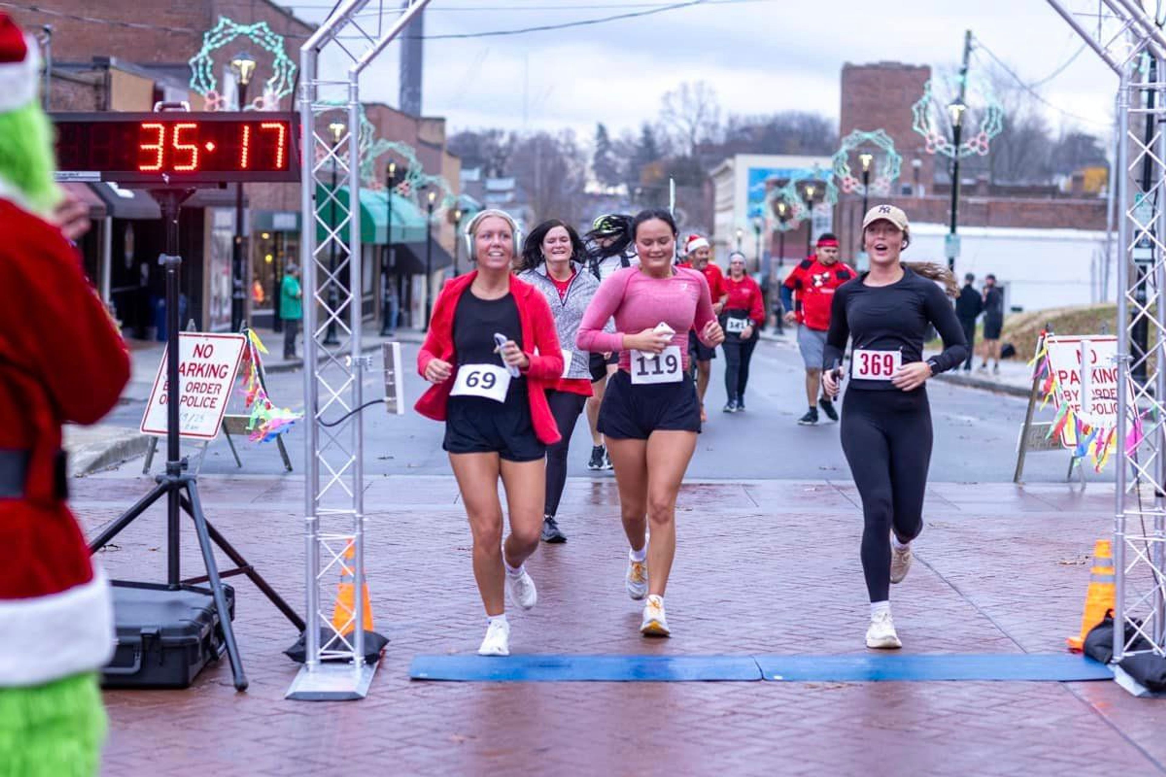 Participants cross the finish line during the 2023 Mary Mingle 5K in Cape Girardeau.