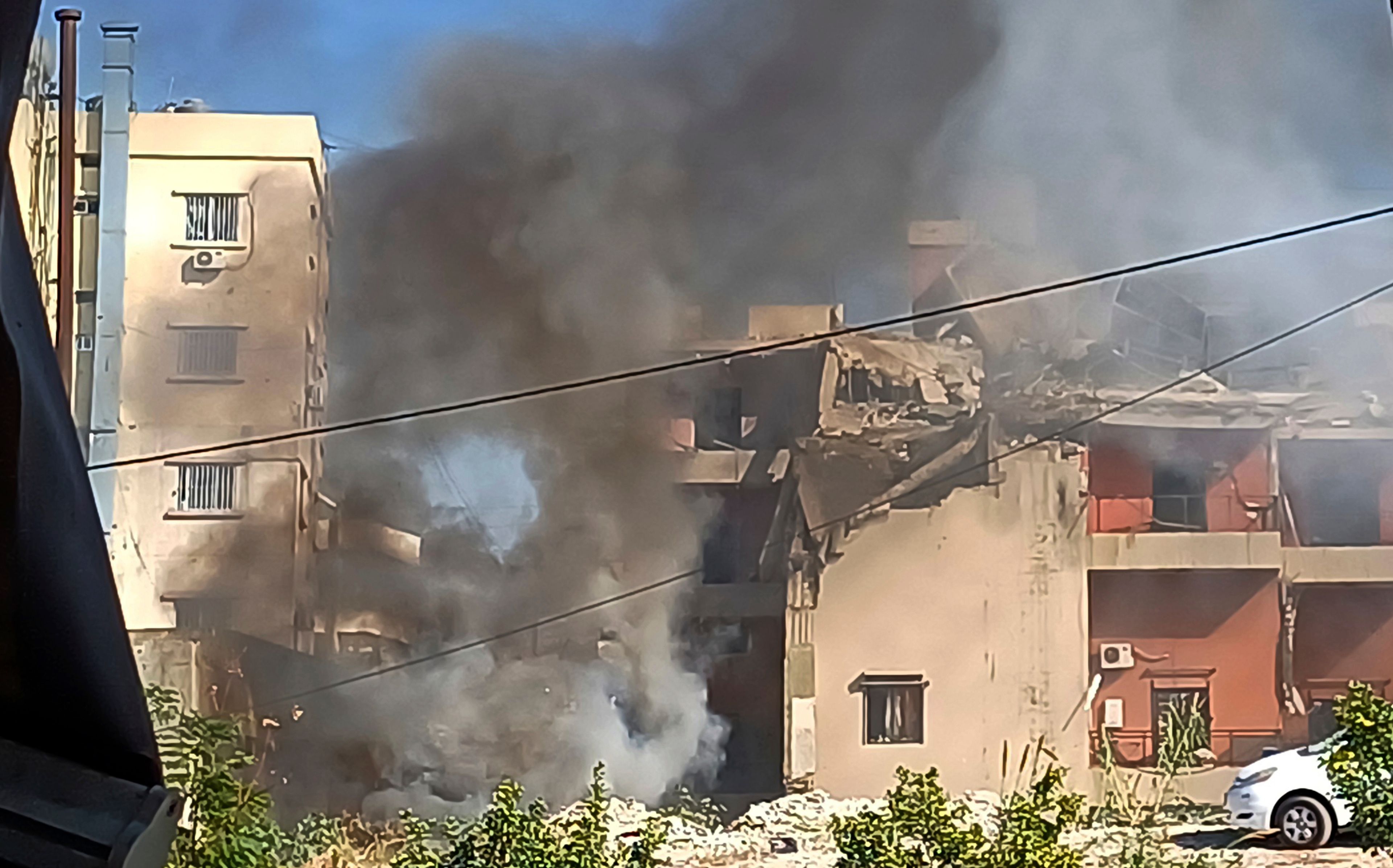 Smoke rises from a building hit by an Israeli airstrike, in the southern port city of Sidon, Lebanon, Sunday, Oct. 27, 2024. (AP Photo/Mohammed Zaatari)