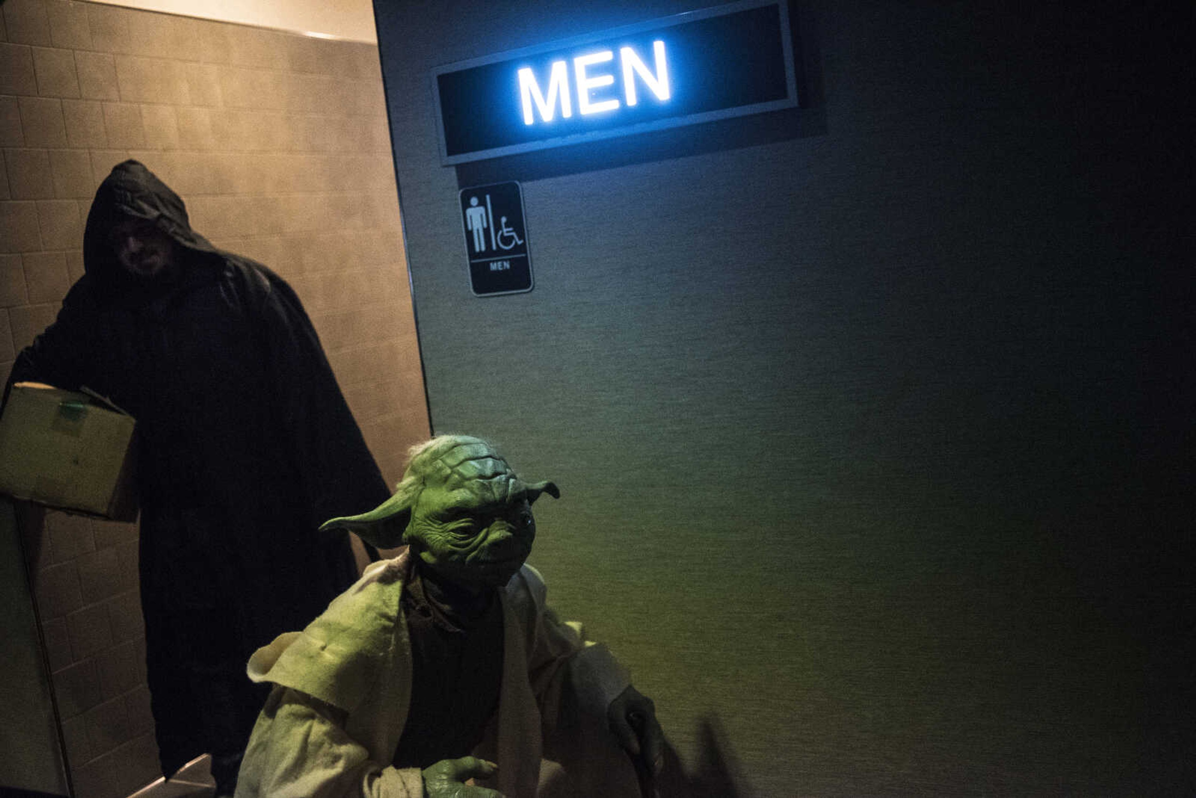 Elias Raley and Trey Kerley with the Southern Illinois Jedi Order walk out of the bathroom before the showing of Star Wars: The Last Jedi Thursday, Dec. 14, 2017 at Cape West Cinema in Cape Girardeau.