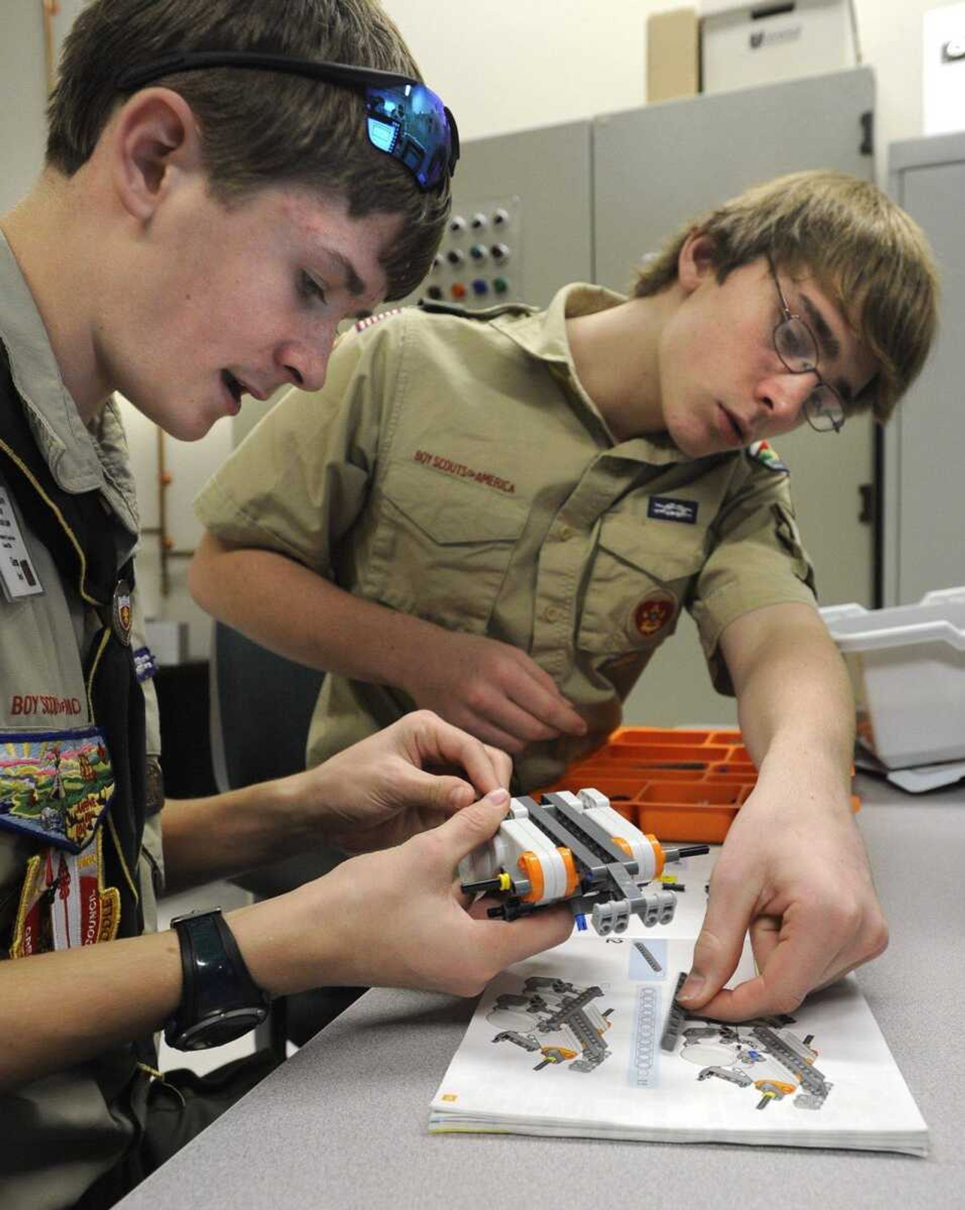 Glen Boyd, left, and John Singleton, Boy Scouts with Troop 11 of Jackson, build a Lego robot Saturday in the robotics class of STEM University at Southeast Missouri State University in Cape Girardeau. (Fred Lynch)