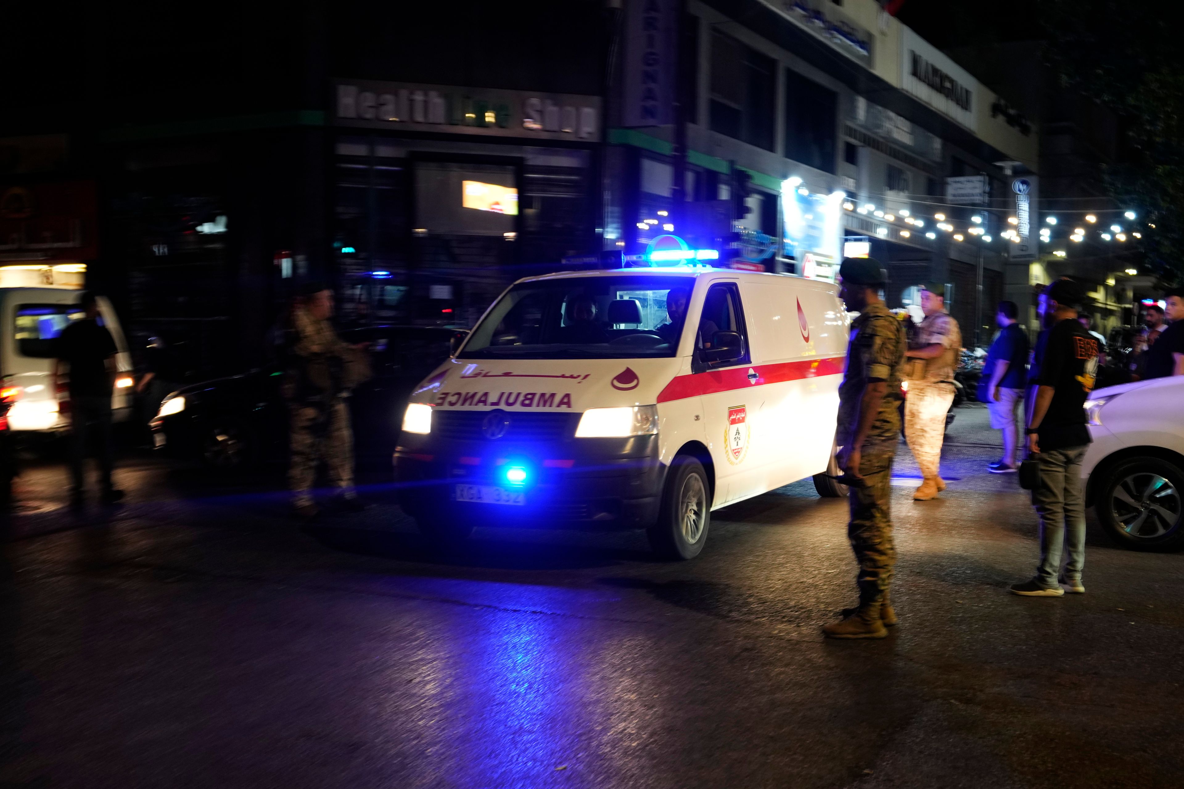 An ambulance carrying wounded people whose handheld pager exploded arrives outside at the American University hospital, in Beirut, Lebanon, Tuesday, Sept. 17, 2024. (AP Photo/Hassan Ammar)