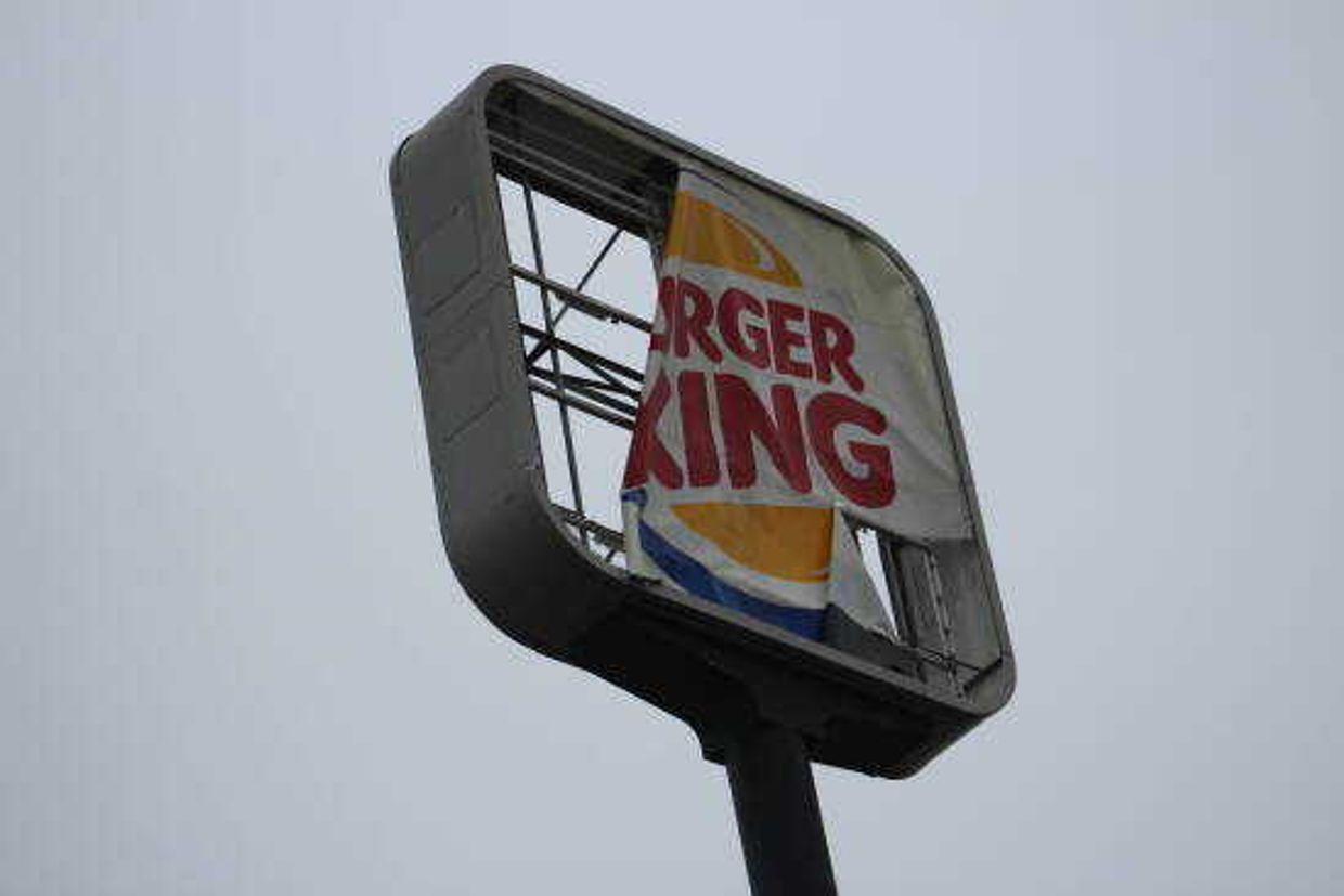 Burger King sign in Dexter damaged by storms Saturday.