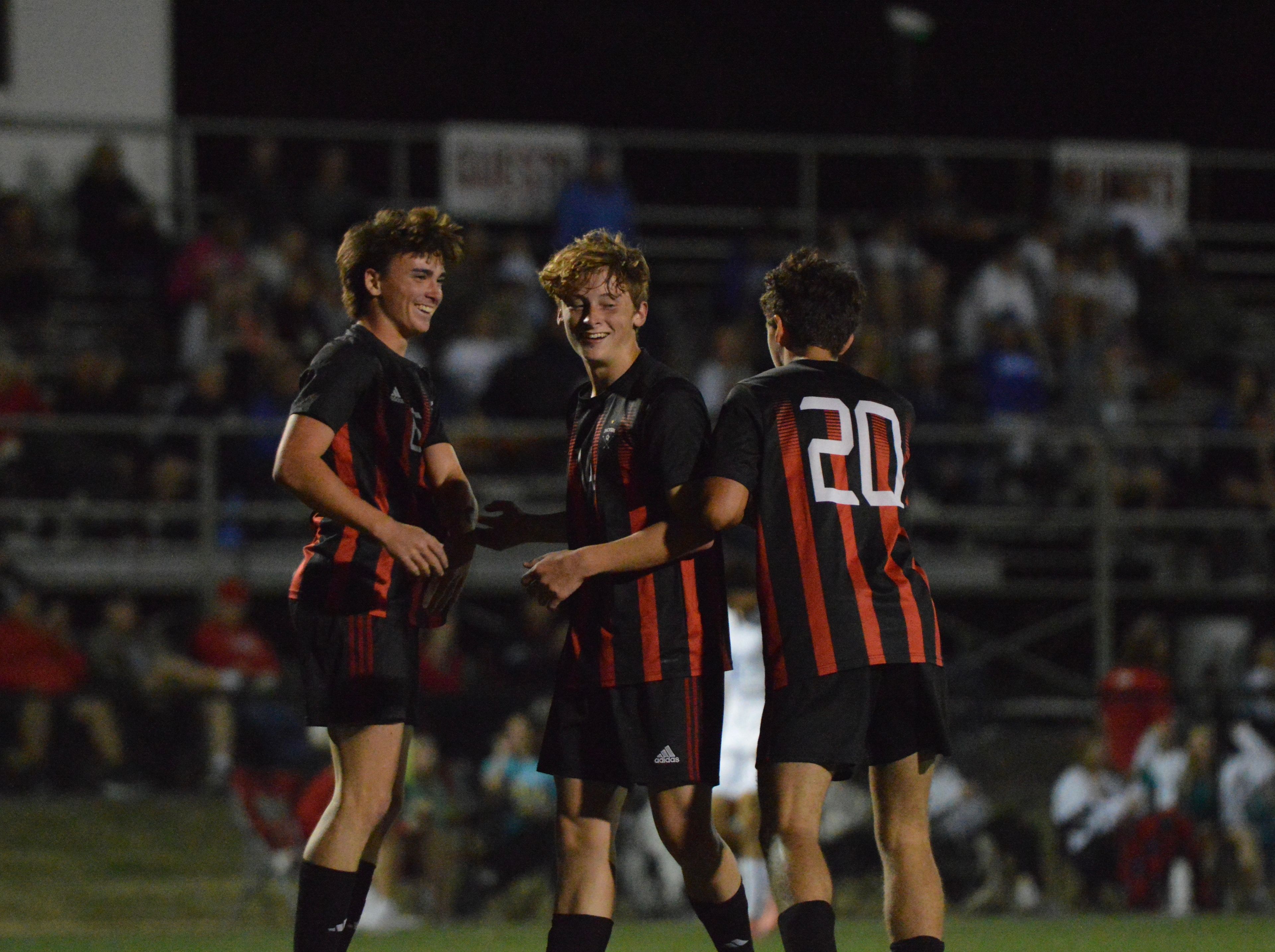 Jackson's Ian Squires celebrates with his teammates following a goal against Notre Dame on Tuesday, Oct. 29.