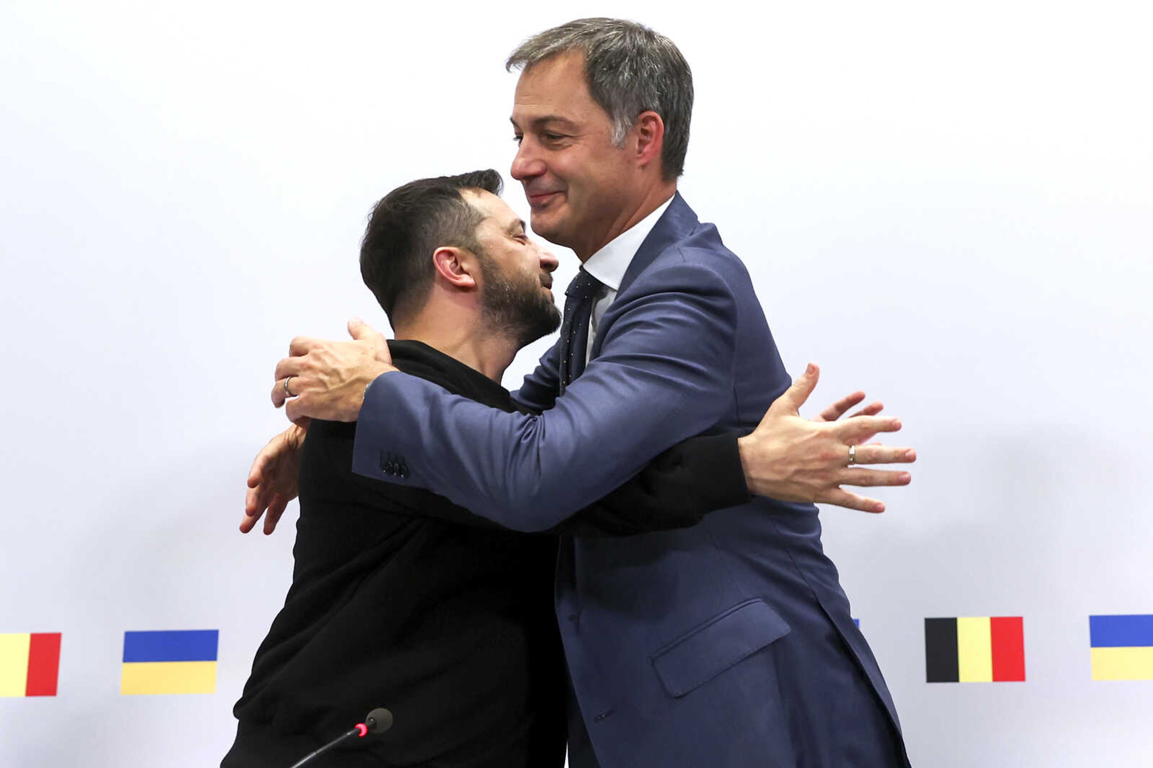 Ukraine's President Volodymyr Zelenskyy, left, is greeted by Belgium's Prime Minister Alexander De Croo after addressing a media conference at the prime ministers office in Brussels, Wednesday, Oct. 11, 2023. (Yves Herman, Pool Photo via AP)