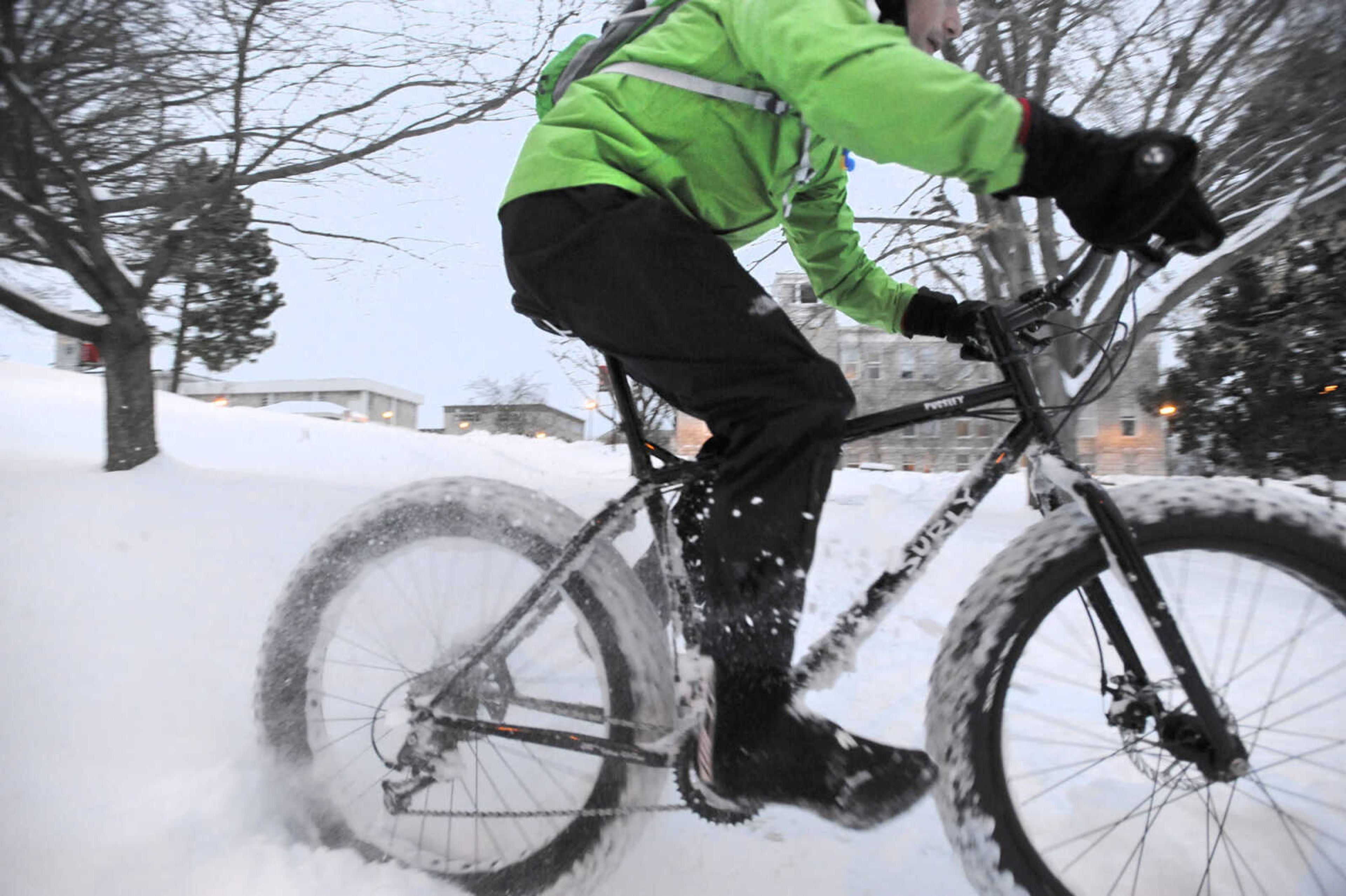 LAURA SIMON ~ lsimon@semissourian.com

Tim Vollink rides his fat bike through the snow on the terraces outside Academic Hall Tuesday evening, Feb. 17, 2015.