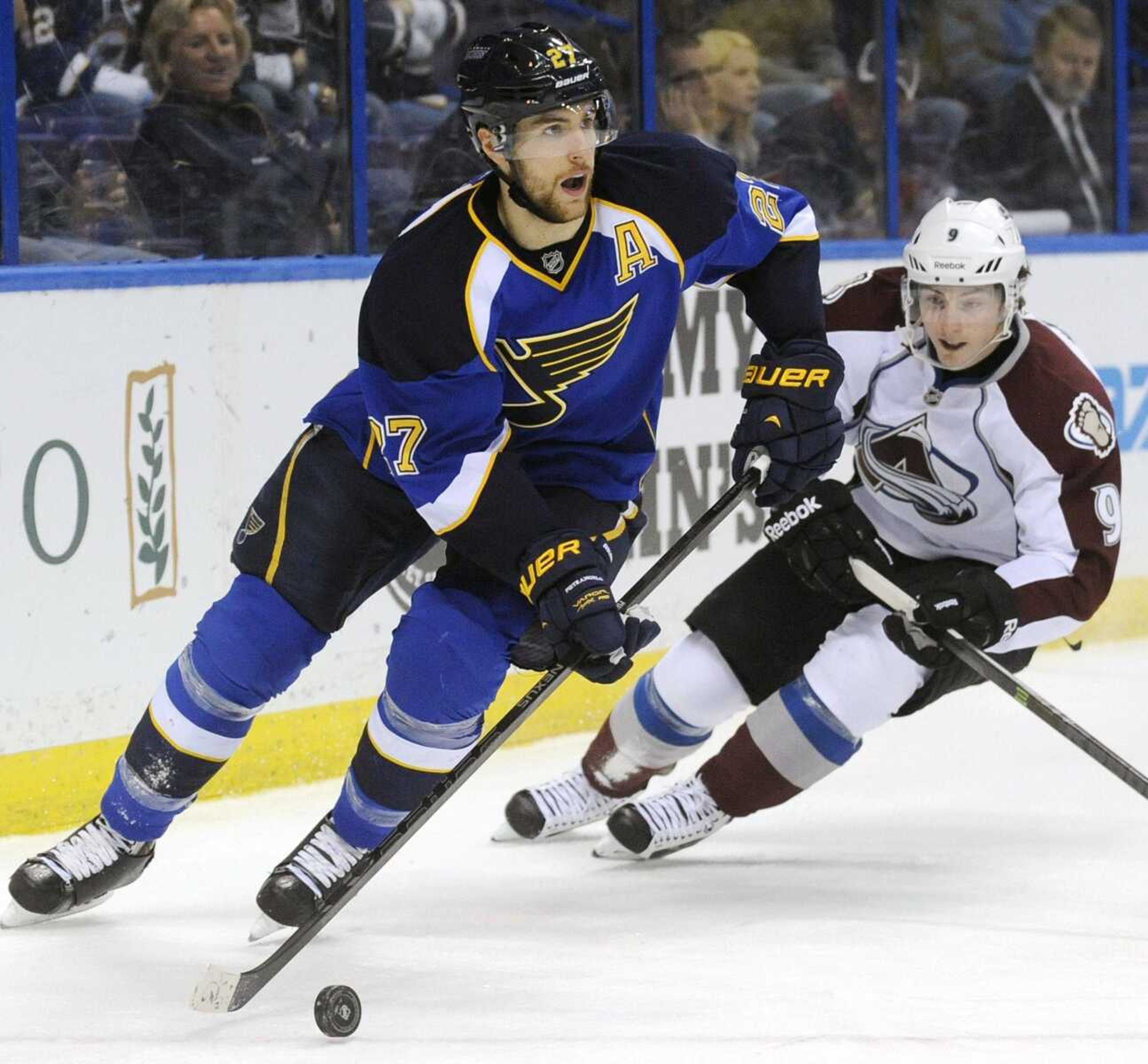 St. Louis Blues' Alex Pietrangelo (27) controls the puck around Colorado Avalanche's Matt Duchene (9) in the first period of an NHL hockey game Tuesday, April 23, 2013, in St. Louis. (AP Photo/Bill Boyce)