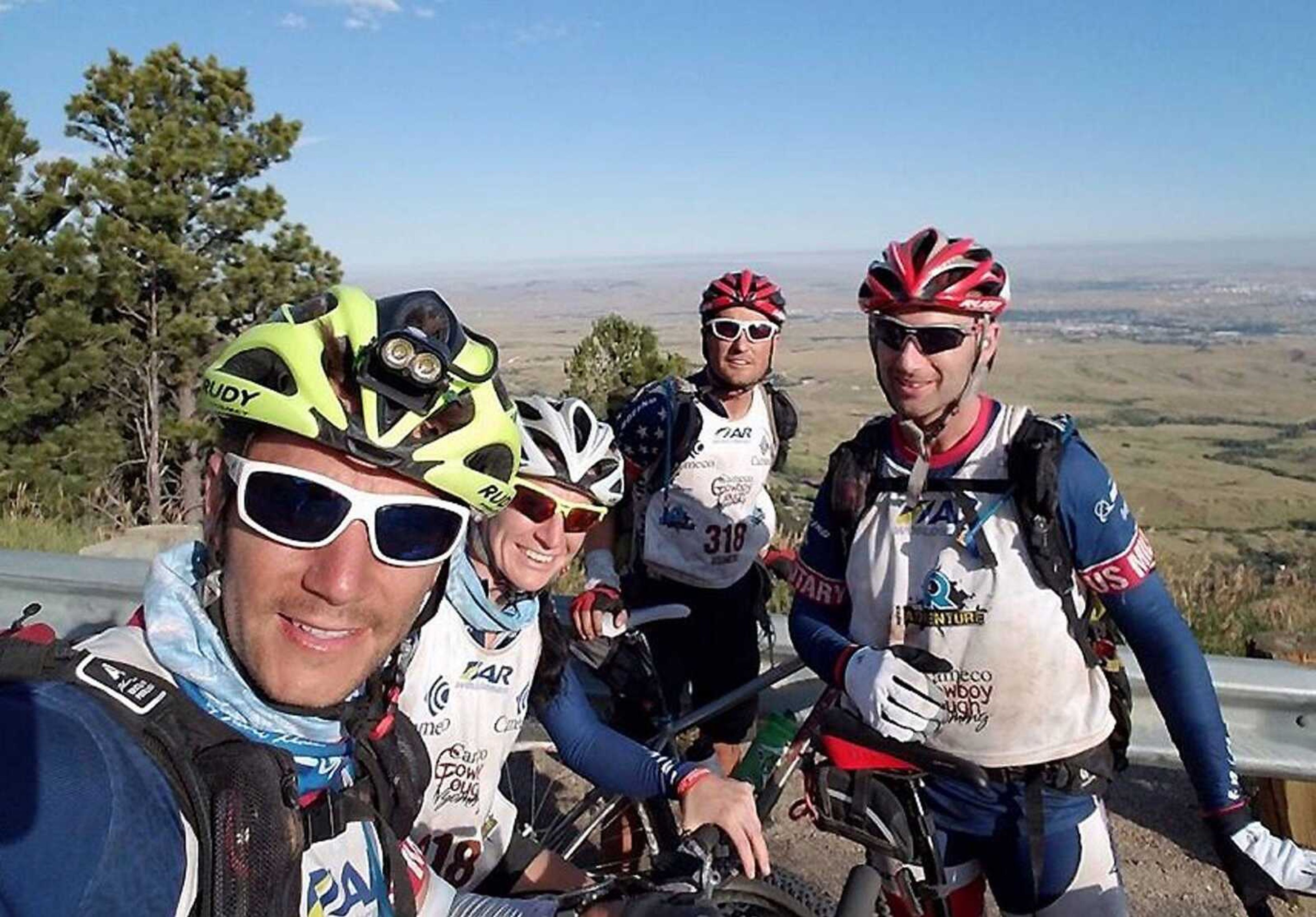 Cape Girardeau's Bryan Greaser, in back, stops during a mountain bike leg of the 3  -day Cowboy Tough adventure race to take a photo with USMES teammates Ron Flick, Shannon Gaffney and Jim Weinstein. The competition sent the team over more than 400 miles around Casper, Wyoming on foot, bike and kayak.