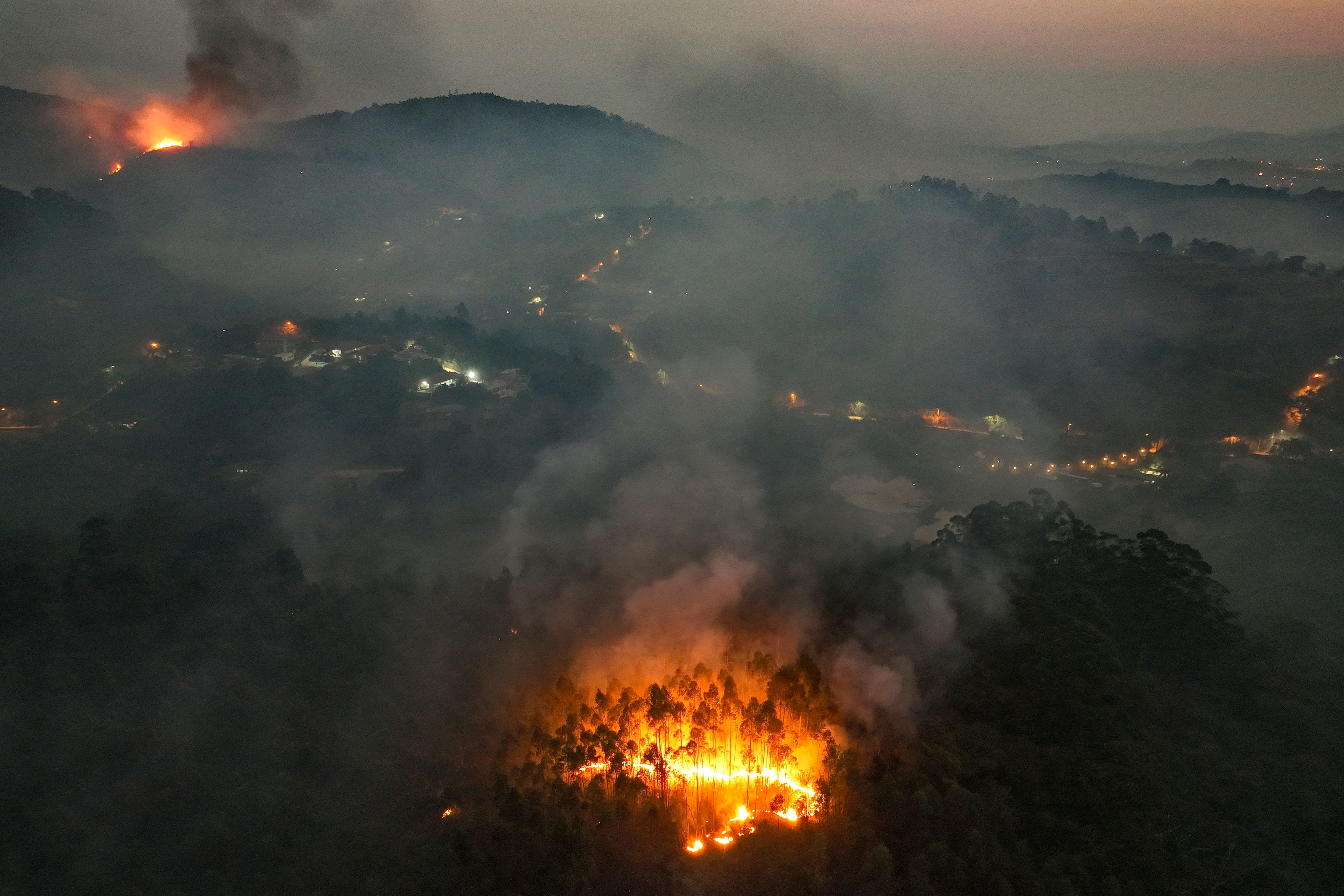 FILE - A wildfire consumes a rural area in Varzea Paulista, Sao Paulo state, Brazil, Sept. 13, 2024. (AP Photo/Andre Penner, File)