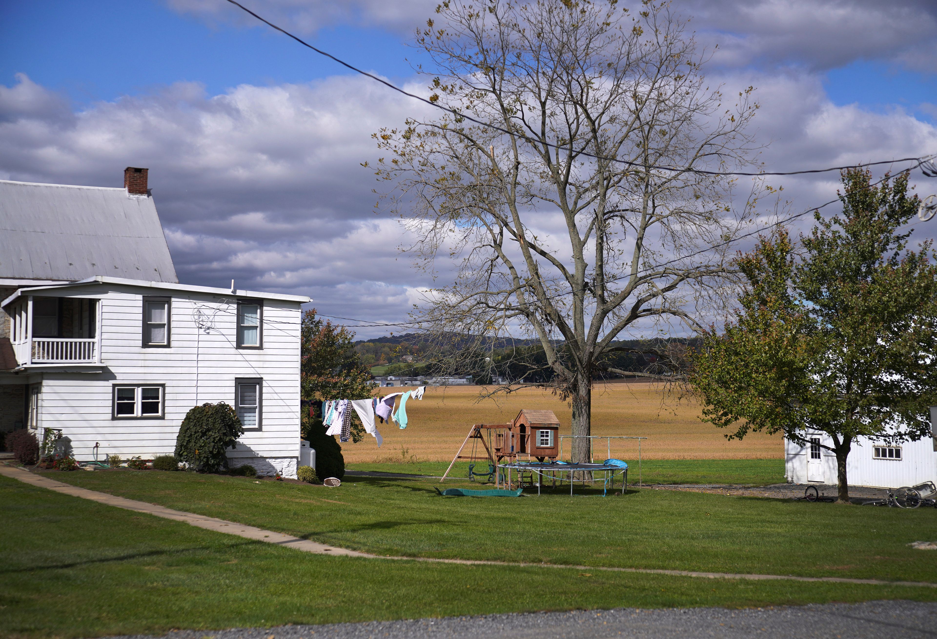 Clothes blow in the wind outside of a home in Ephrata, Pa., on Wednesday, Oct. 16, 2024. (AP Photo/Jessie Wardarski)