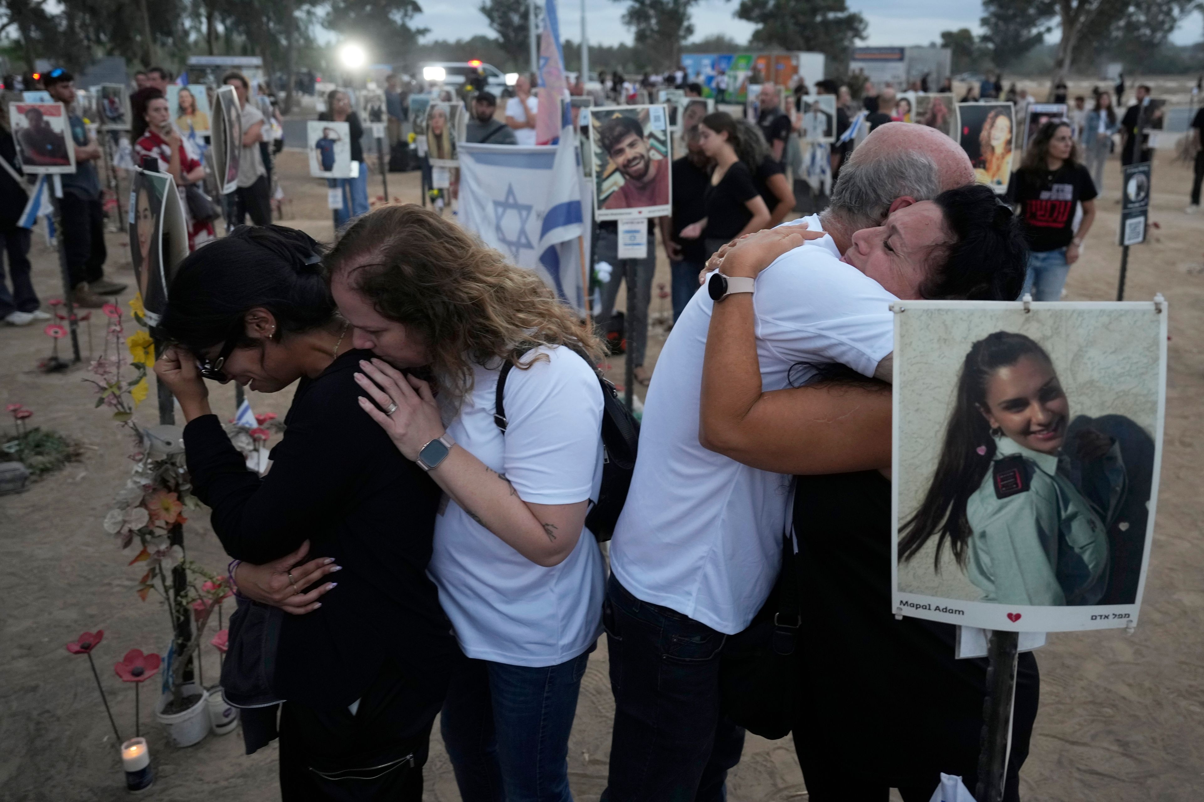 People visit the site of the Nova music festival, where hundreds of revelers were killed and abducted by Hamas and taken into Gaza, on the one-year anniversary of the attack, near Kibbutz Reim, southern Israel, Monday, Oct. 7, 2024. (AP Photo/Ariel Schalit)