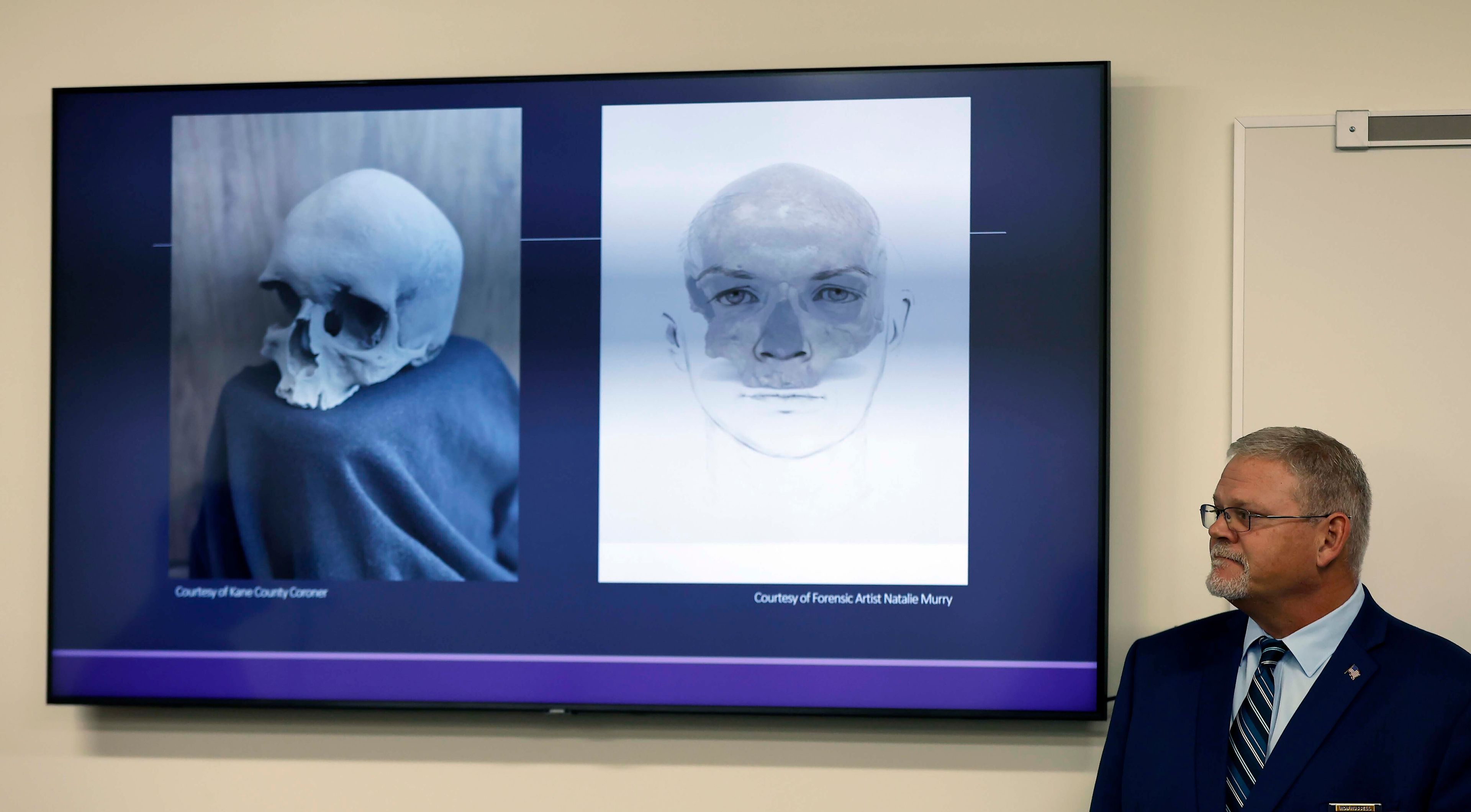 Kane County Coroner Rob Russell is pictured with an artist's rendering of the likeness of Esther Granger and a photograph of her skull during a press conference Thursday, Oct. 24, 2024 in St. Charles, Ill. Investigators have determined that a skull discovered in the wall of an Illinois home in 1978 was that of an Indiana teenager who died more than 150 years ago, authorities announced Thursday. (Brian Hill/Daily Herald via AP)