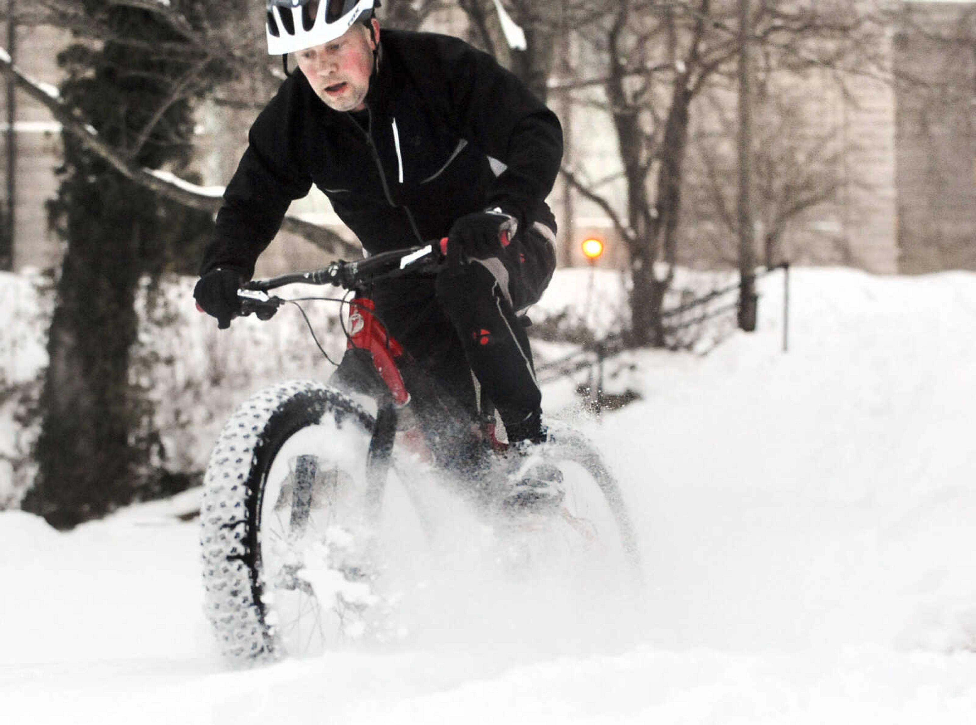 LAURA SIMON ~ lsimon@semissourian.com

Bob Berck rides his fat bike through the snow on the terraces outside Academic Hall Tuesday evening, Feb. 17, 2015.