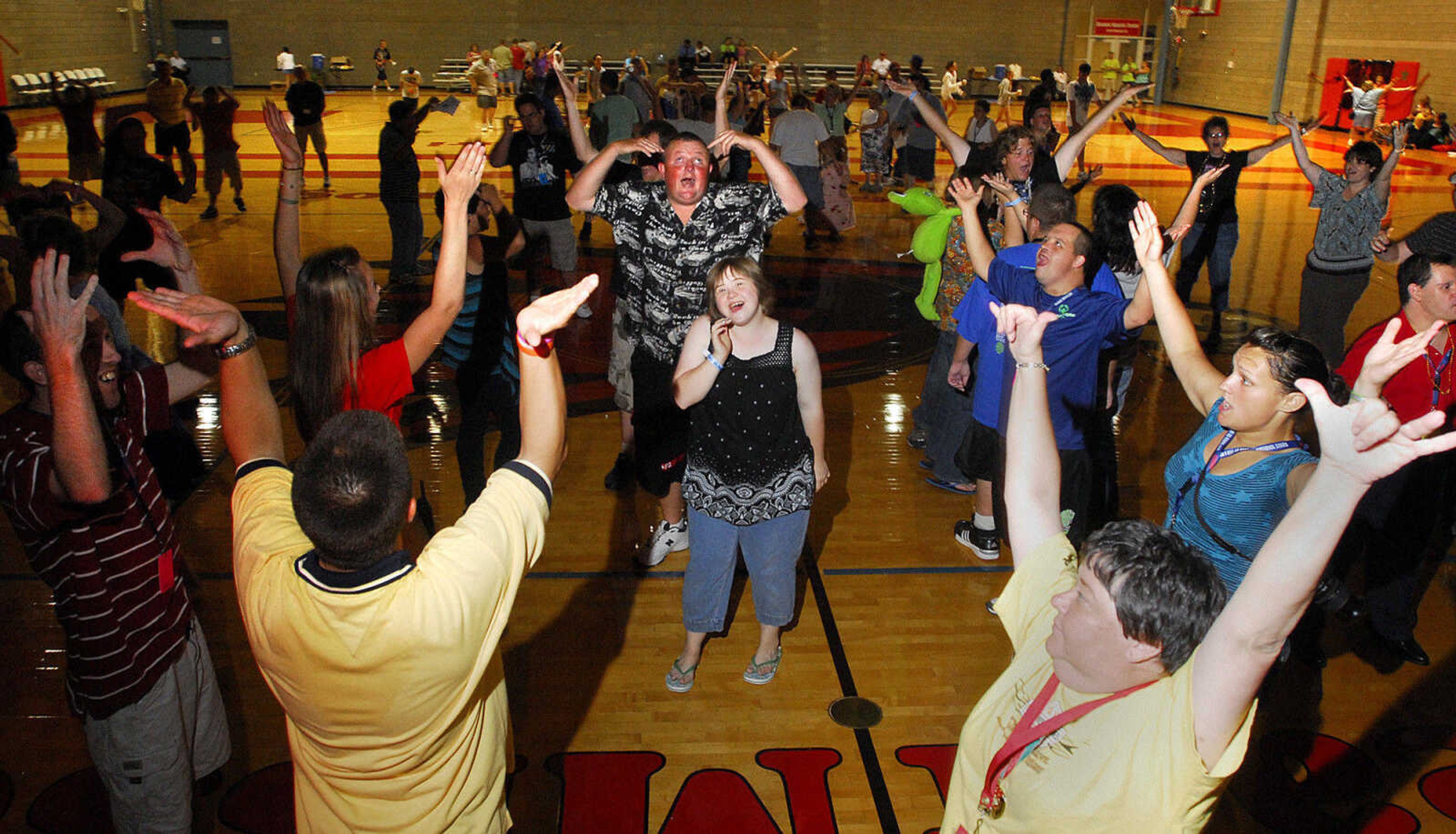 LAURA SIMON~lsimon@semissourian.com
Special Olympic athletes, coaches, and volunteers dance to YMCA Saturday, August 14, 2010 during the dance at Southeast Missouri State University's student Rec Center.