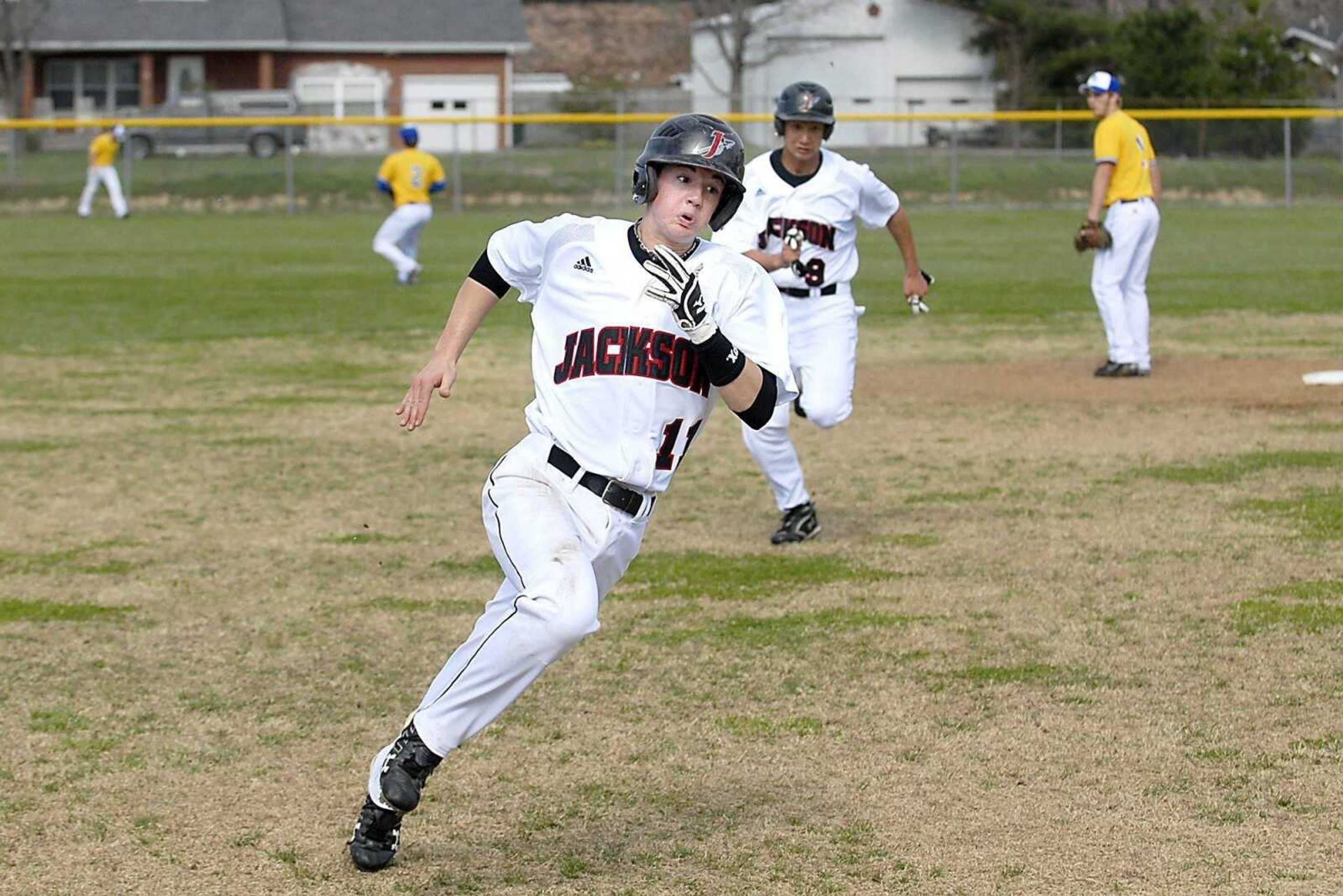 KIT DOYLE ~ kdoyle@semissourian.comJackson baserunner Josh Duncan heads for third Monday, March 23, 2009, in Scott City.