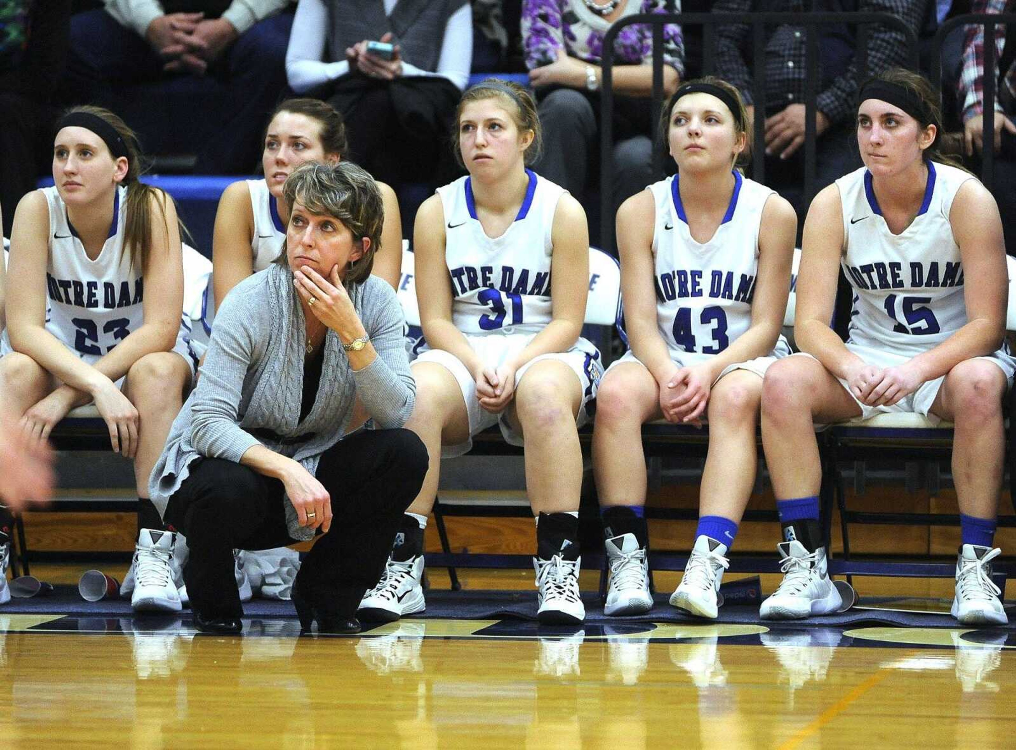 Notre Dame coach Renee Peters watches a free throw attempt against Dexter with Sam Feeney, left, Cheyenne Sander, Brooke Blankenship, Megan Heisserer and Maddie Urhahn as their team trails during the third quarter Monday, Feb. 8, 2016 at Notre Dame Regional High School.