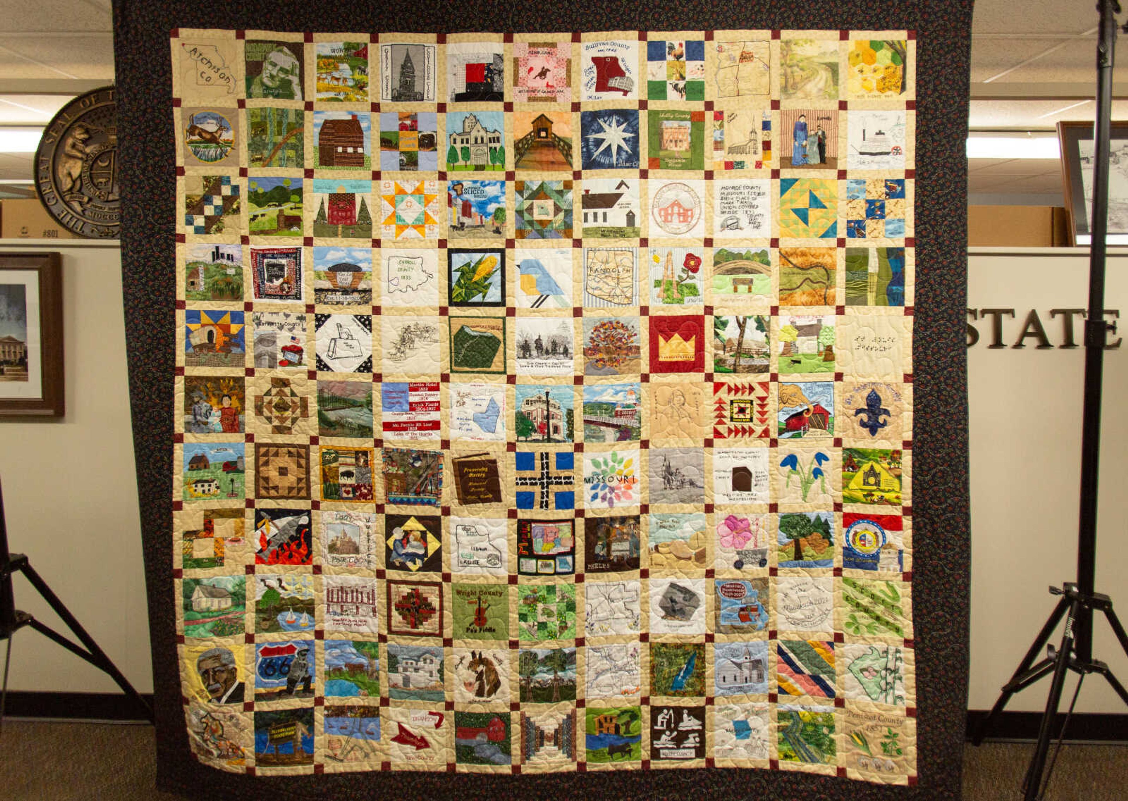 The Missouri State Bicentennial Quilt hangs on display at the State Historical Society of Missouri Cape Girardeau Research Center. The quilt features squares from Missouri counties laid out based on the state's geography and will be on display through April 29.