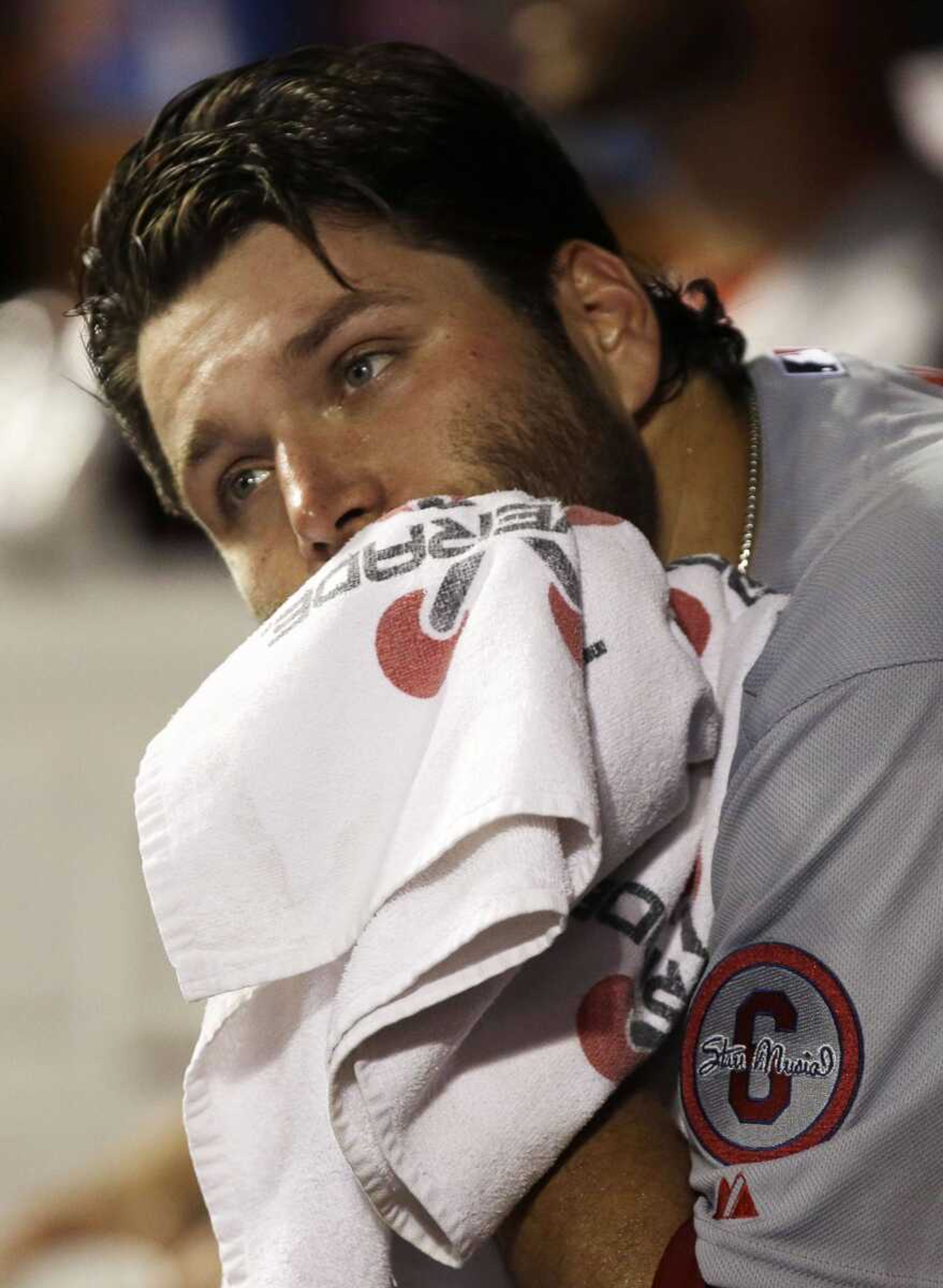 St. Louis Cardinals starting pitcher Lance Lynn sits in the dugout in the fourth inning of a baseball game against the Cincinnati Reds, Thursday, Sept. 5, 2013, in Cincinnati. Lynn was the losing pitcher as Cincinnati won 6-2. (AP Photo/Al Behrman)