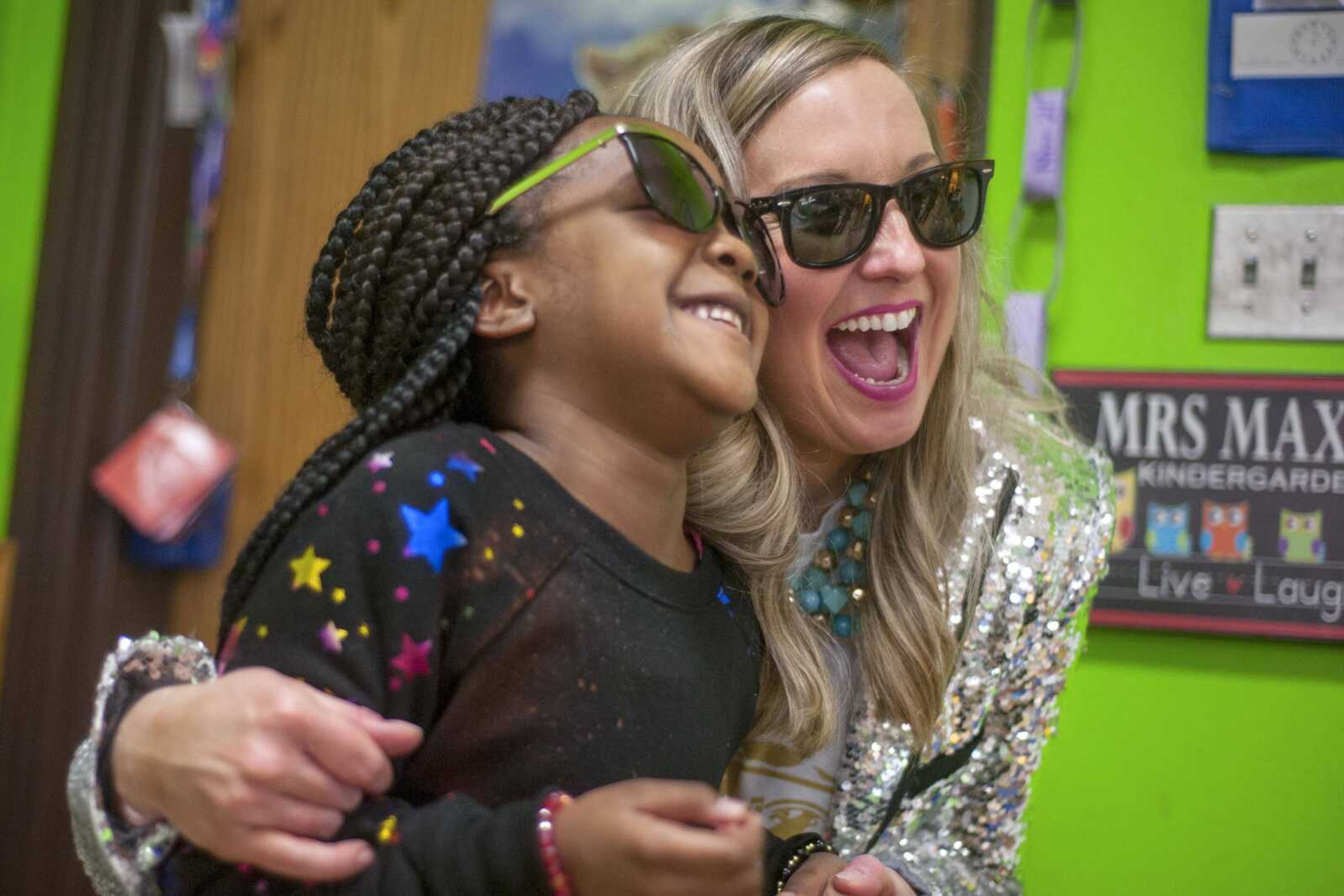 Principal Leigh Ragsdale laughs with kindergartener Lyla Lowe while wearing sunglasses Friday, Jan. 31, 2020, at the Jefferson Elementary in Cape Girardeau. Published Feb. 8, 2020.