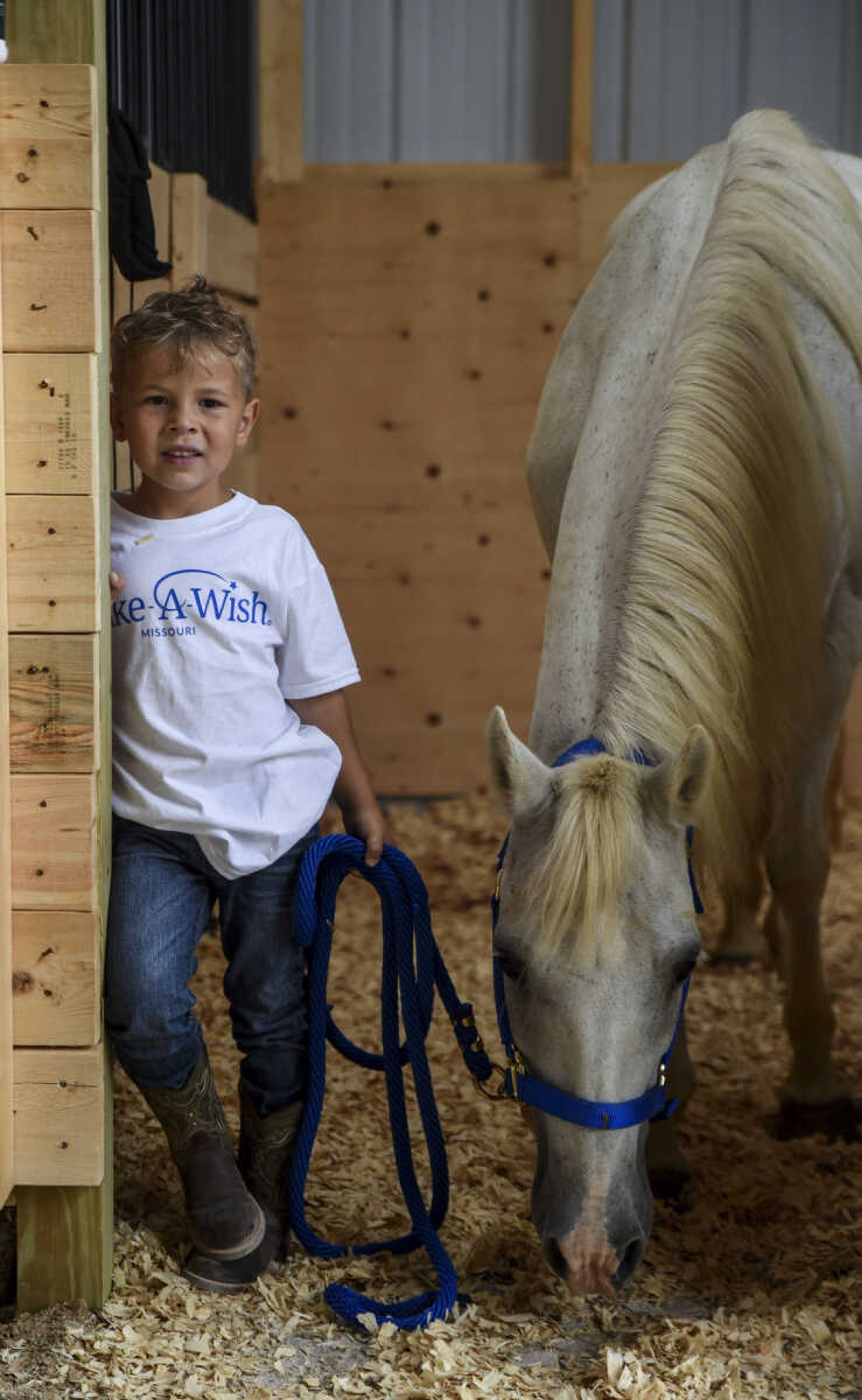 Nate Prichard, 5, poses for a photo with his new horse Silver Monday, July 30, 2018 in&nbsp;Burfordville.