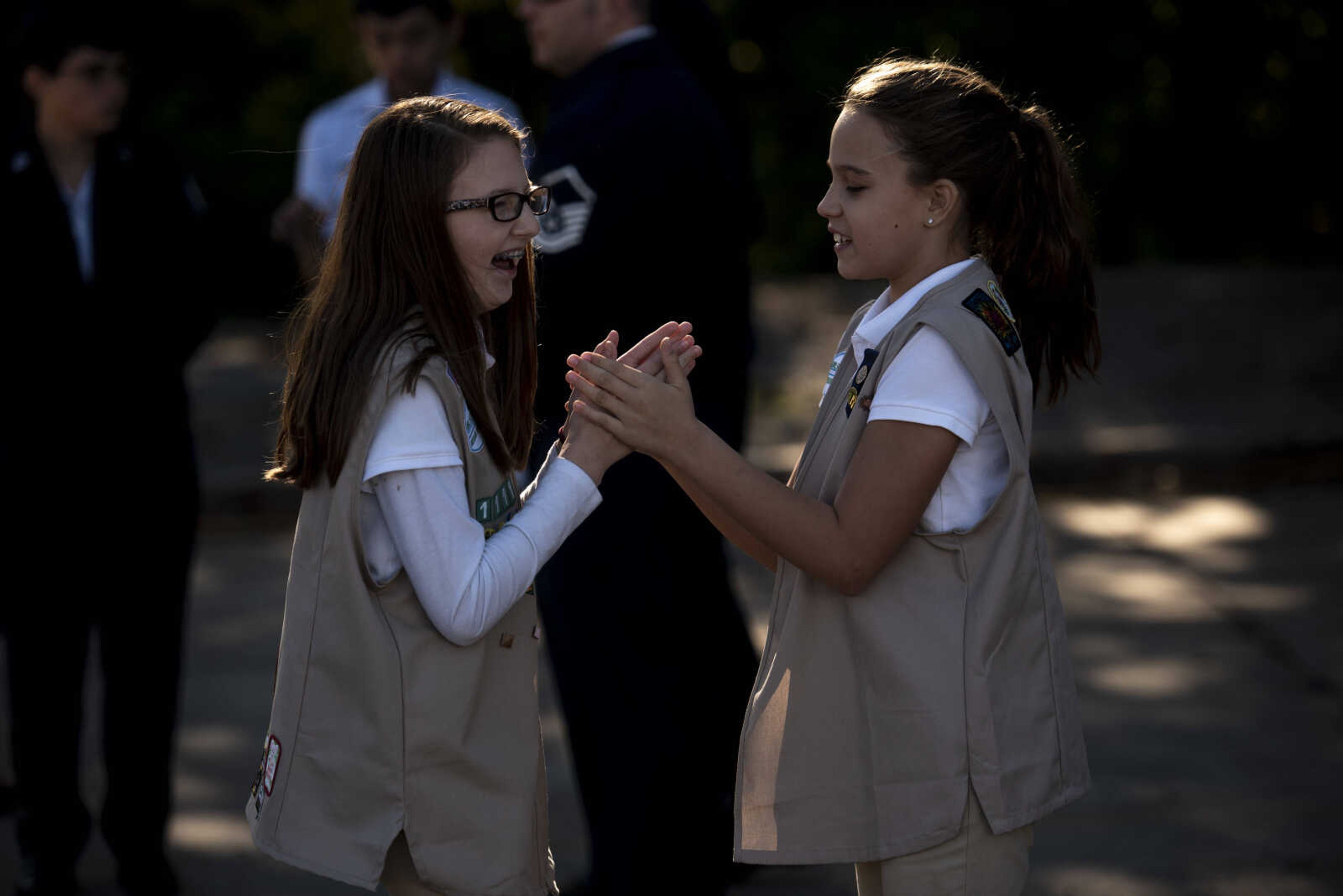 From left, Kayden Barry, 11, and Gwenyth Speight, 11, keep busy before the start of the inaugural flag retirement ceremony at VFW Post 3838 Sunday, Oct. 21, 2018, in Cape Girardeau.