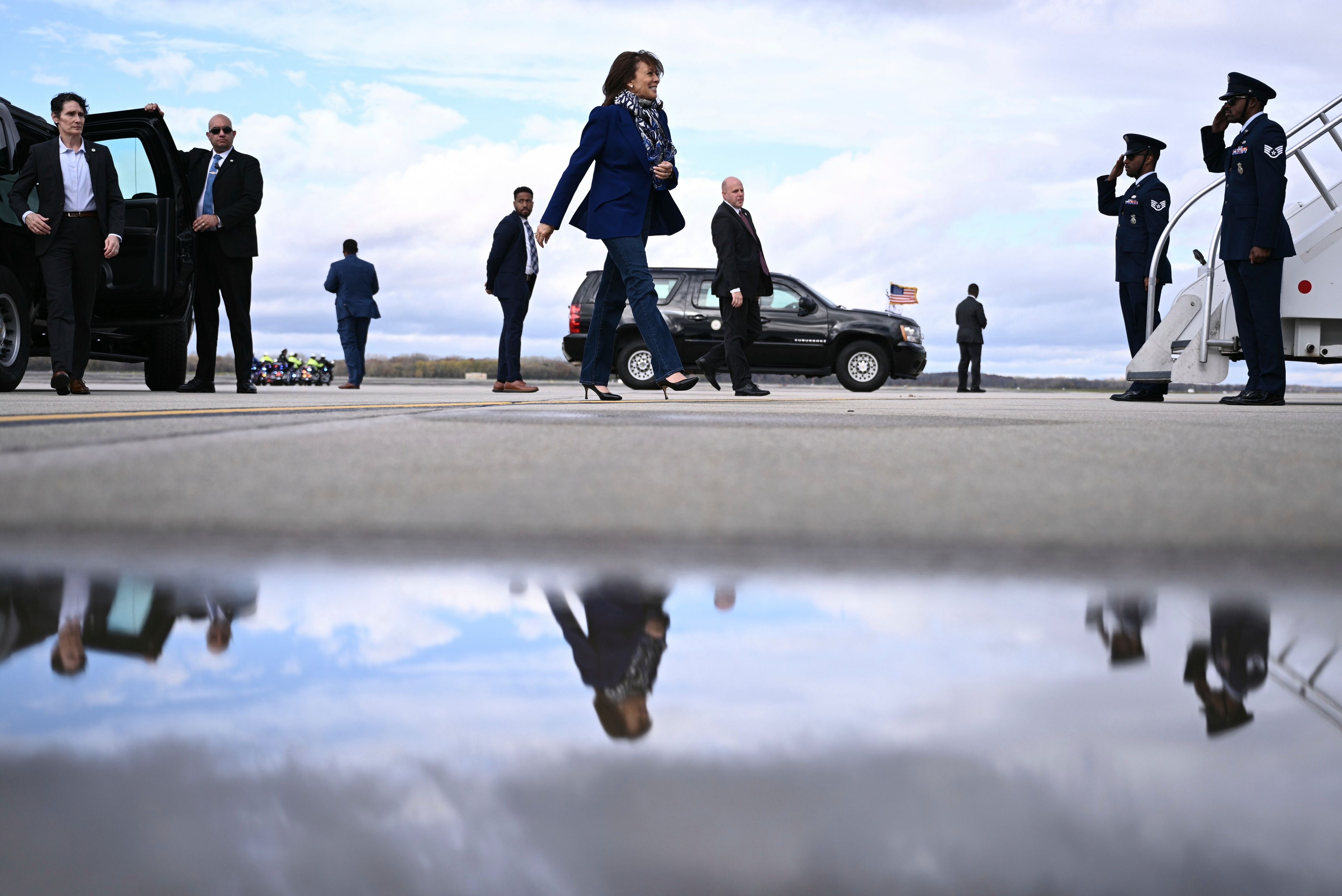 Democratic presidential nominee Vice President Kamala Harris walks to board Air Force Two before departing Dane County Regional Airport in Madison, Wis., Thursday, Oct. 31, 2024. (Brendan Smialowski/ Pool via AP)