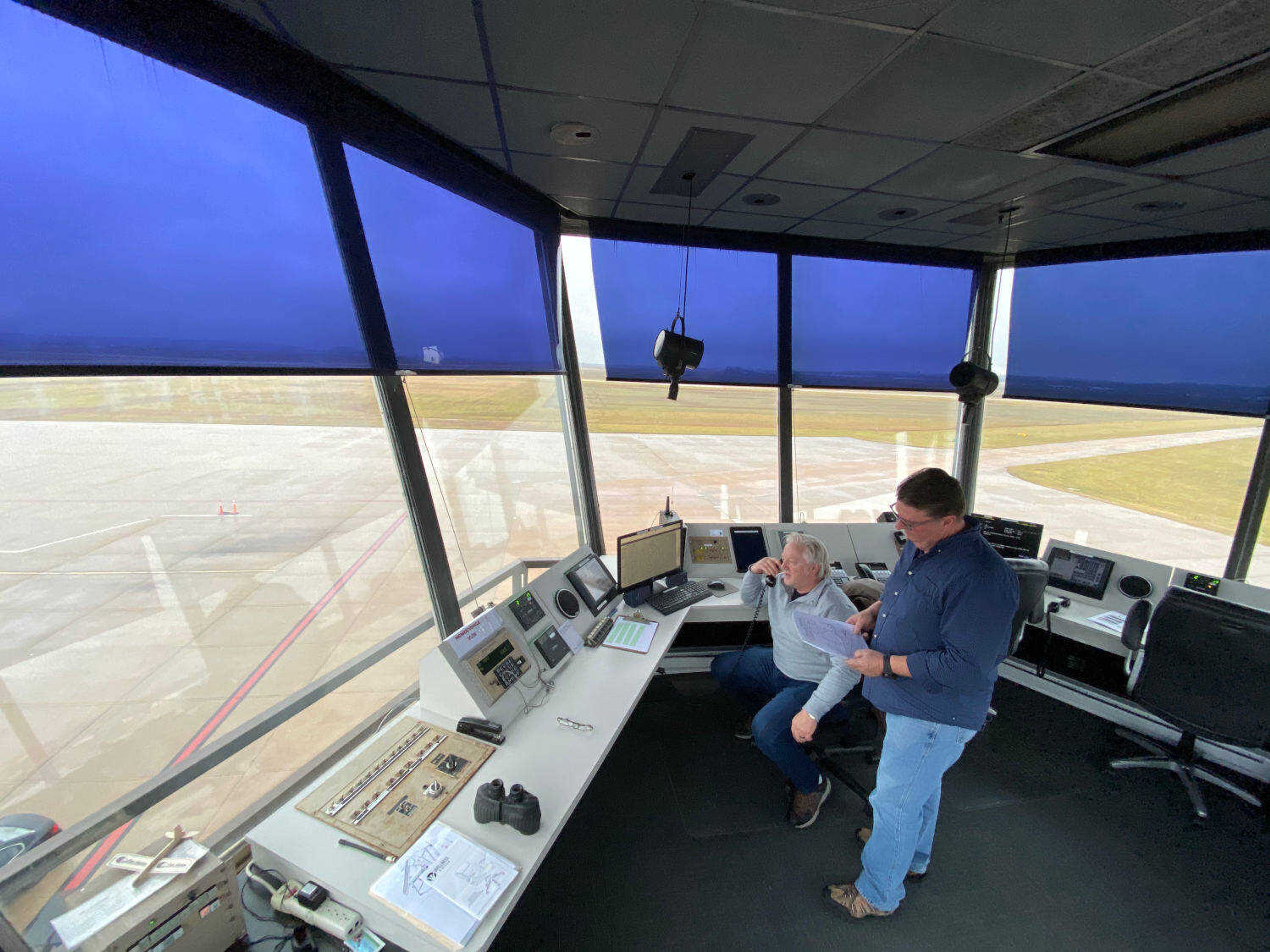 Cape Girardeau Regional Airport Tower manager Larry Davis, standing, and Timmy Brown.