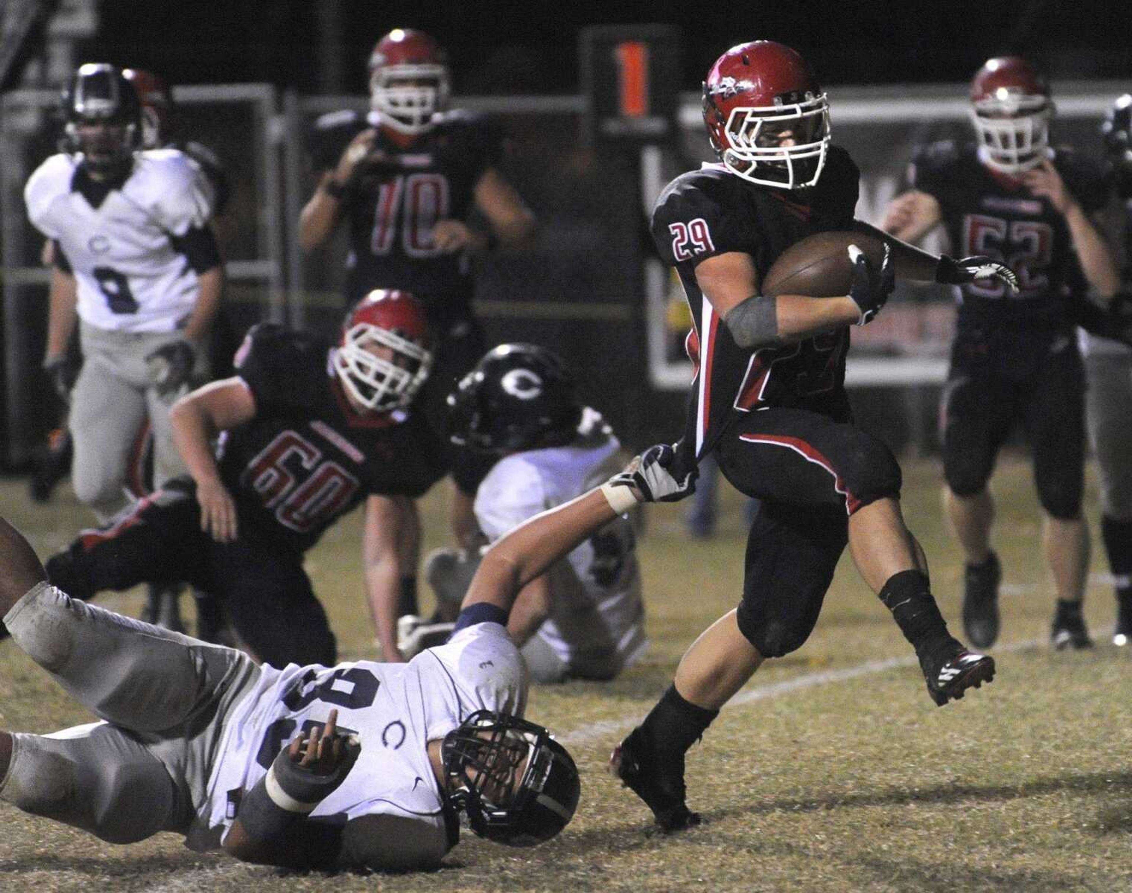 Jackson&#8217;s Colten Proffer scores a touchdown after running away from Francis Howell Central&#8217;s Derrick Puni during the third quarter Friday in Jackson. (Fred Lynch)