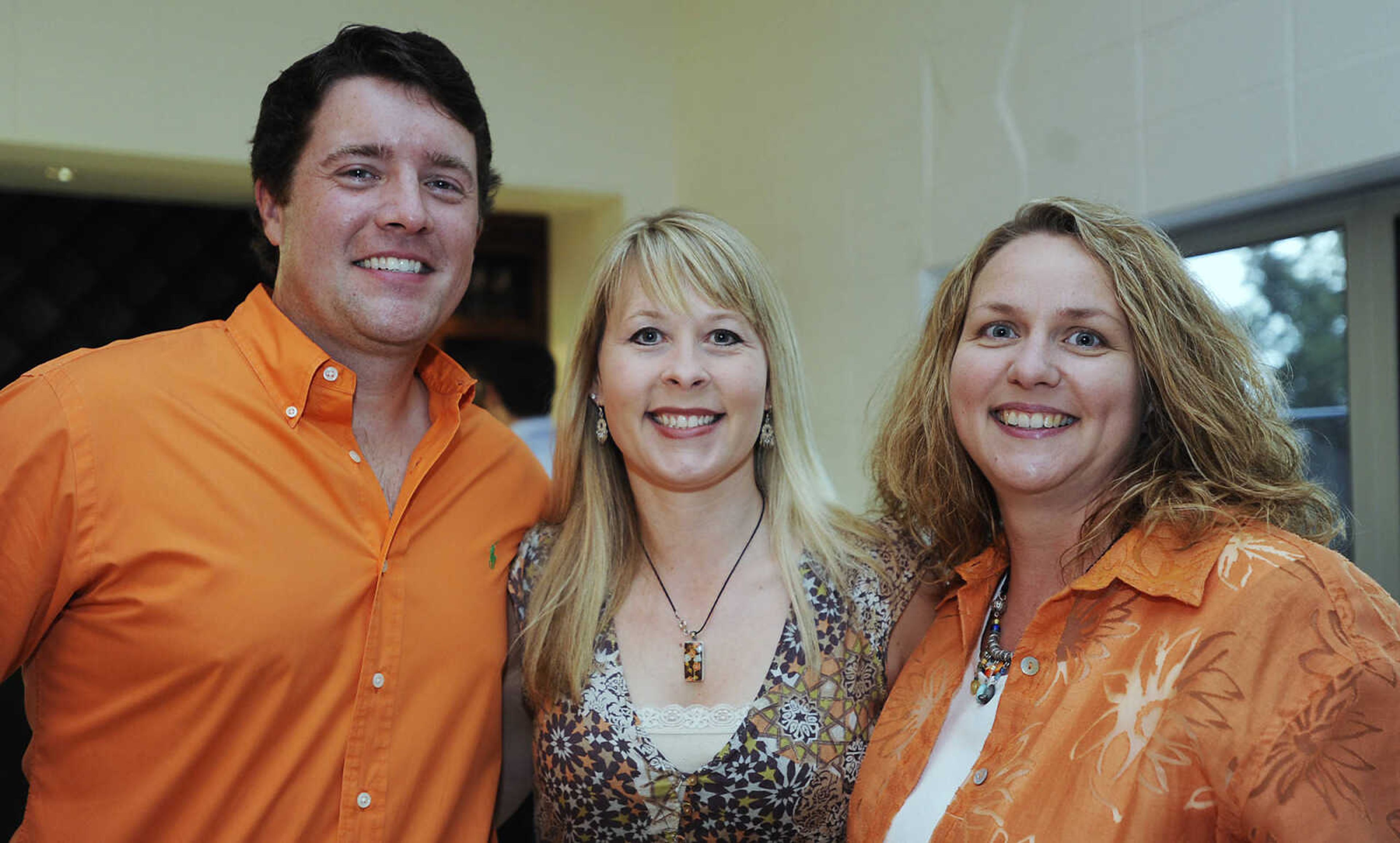 Justin Taylor, left, Maggie Buckley and Brandelin Frazier at The Summer Cocktail Soiree Friday, Aug. 3, at the Concourse, 429 N. Broadview St. in Cape Girardeau. A fundraiser for Levi's Adventure Trail, an exhibit at the Discovery Playhouse in Cape Girardeau, the event featured live music, a silent auction and gourmet appetizers. The exhibit is named after Levi Stephen Collom, who died at age 3 earlier this year. Mosley is Levi's grandfather.