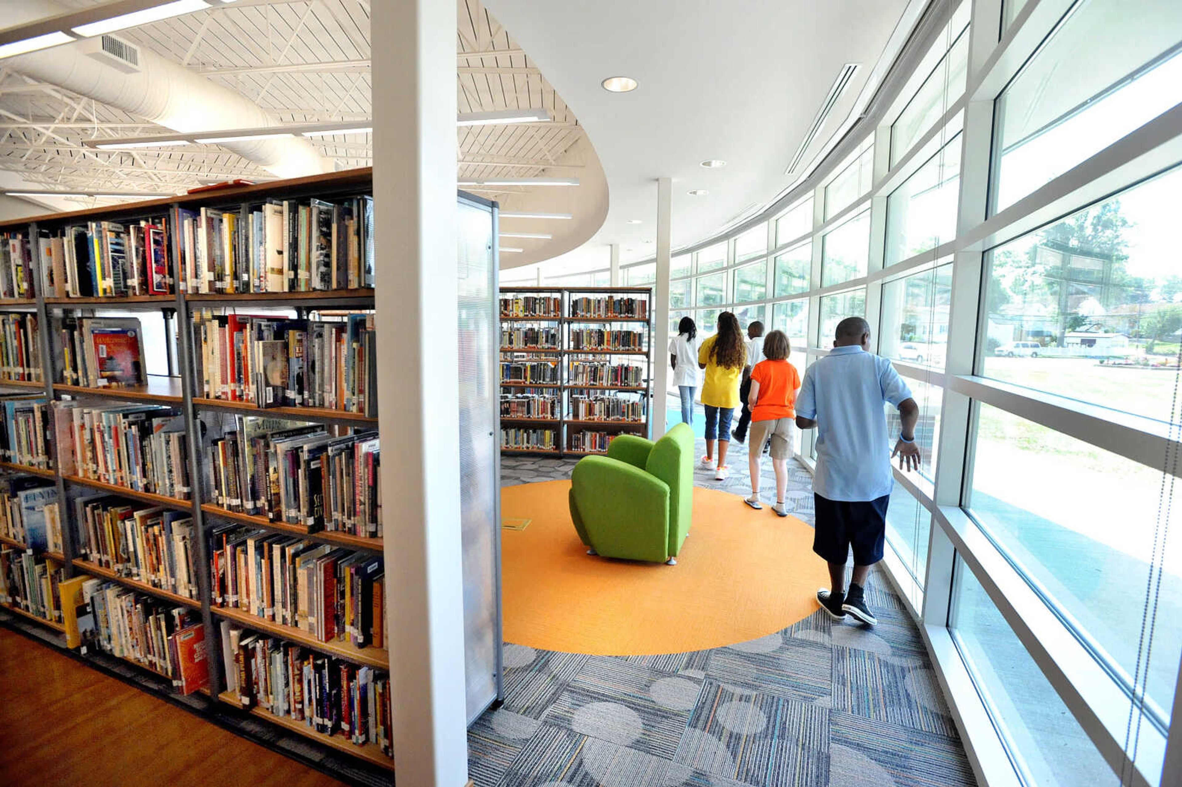 LAURA SIMON ~ lsimon@semissourian.com
Central Junior High School students tour the new library Thursday morning, Aug. 16, 2012 on their first day of school. The new 8300 sq. foot library's design mimics that of an open book as you enter. The library also features a computer lab, classroom space and homework stations.