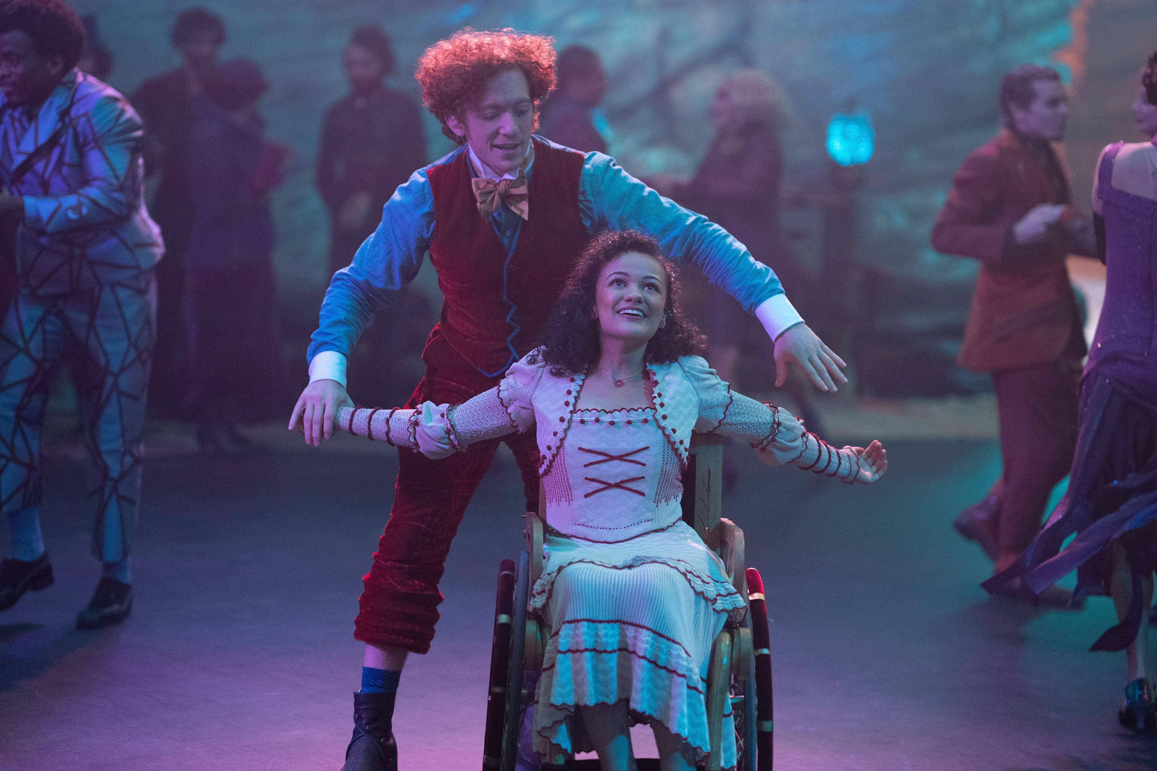 This image released by Universal Pictures shows Ethan Slater, left, and Marissa Bode in a scene from the film "Wicked." (Giles Keyte/Universal Pictures via AP)