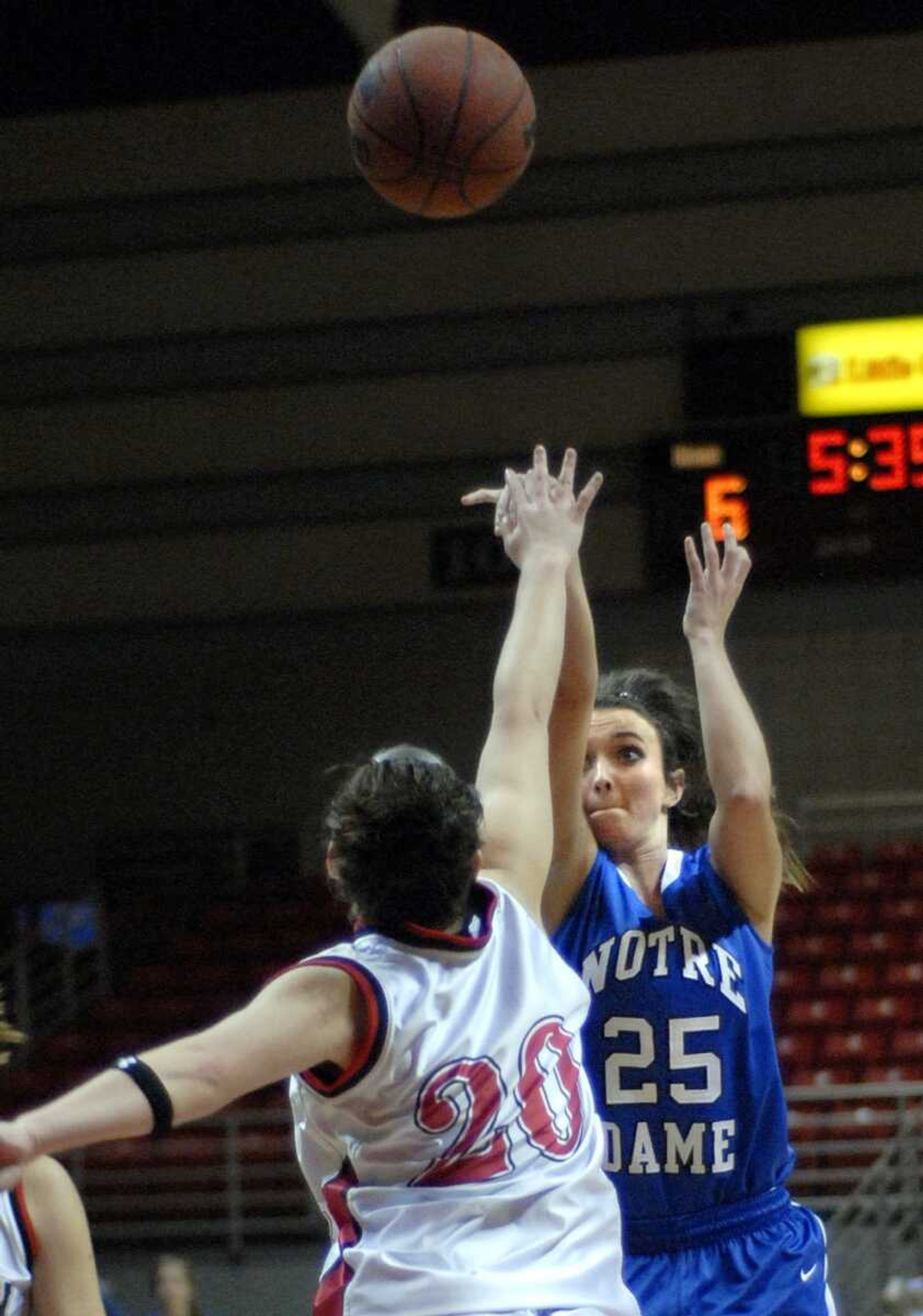 Notre Dame's Brooke Bohnert shoots over Meadow Heights' Taylor Cureton during the first quarter of their Kelso Supply Holiday Classic semifinal game Wednesday at the Show Me Center. (Laura Simon)