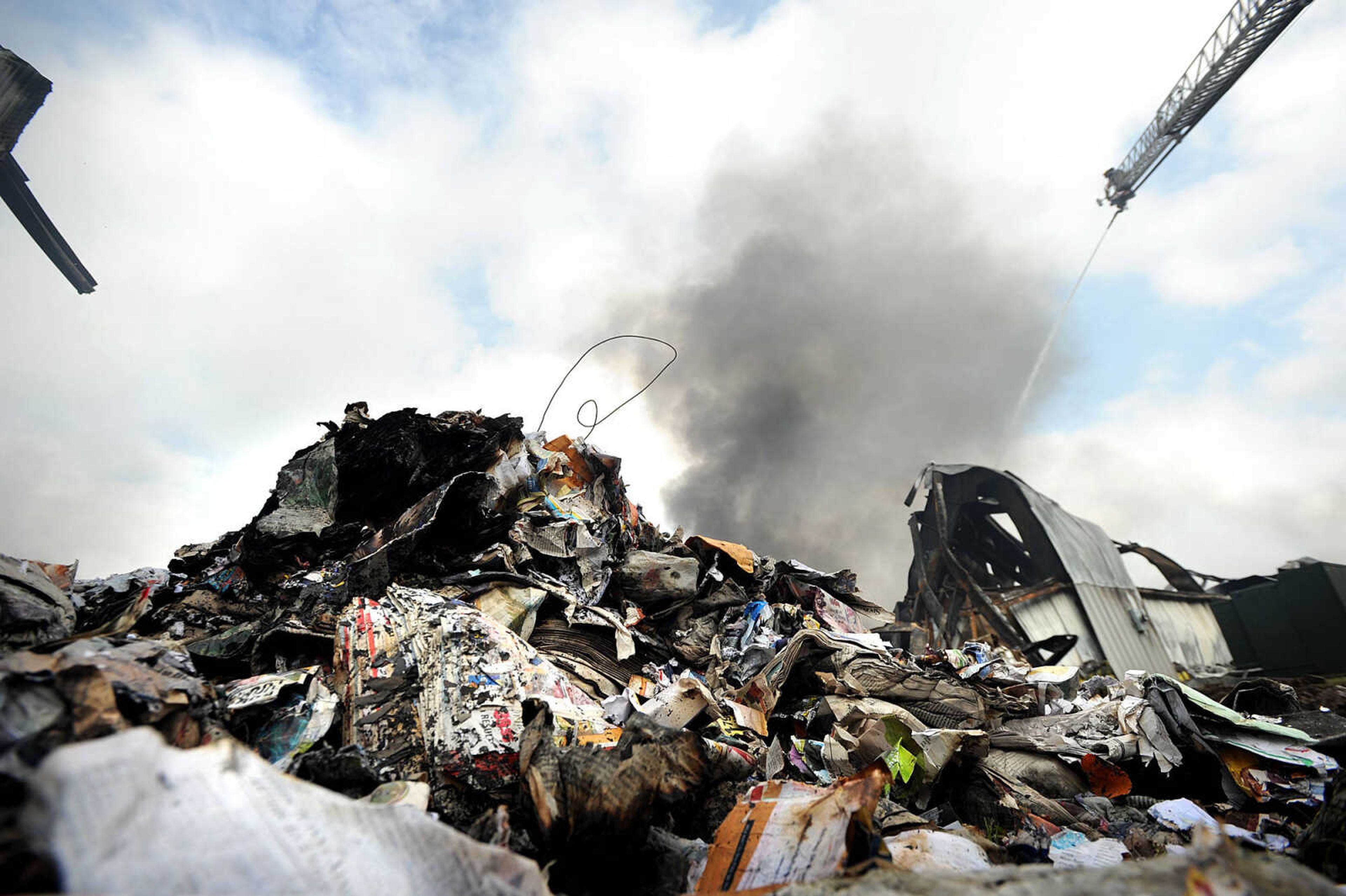 LAURA SIMON ~ lsimon@semissourian.com

Jamie Hann with the Cape Girardeau Fire Department showers the smoldering remnants of the Missouri Plastics plant Friday morning, Oct. 4, 2013, in Jackson. The approximately 100,00-square-foot recycling plant caught fire around 10 p.m. Thursday. Every fire department in Cape Girardeau County was dispatched to battle the blaze.