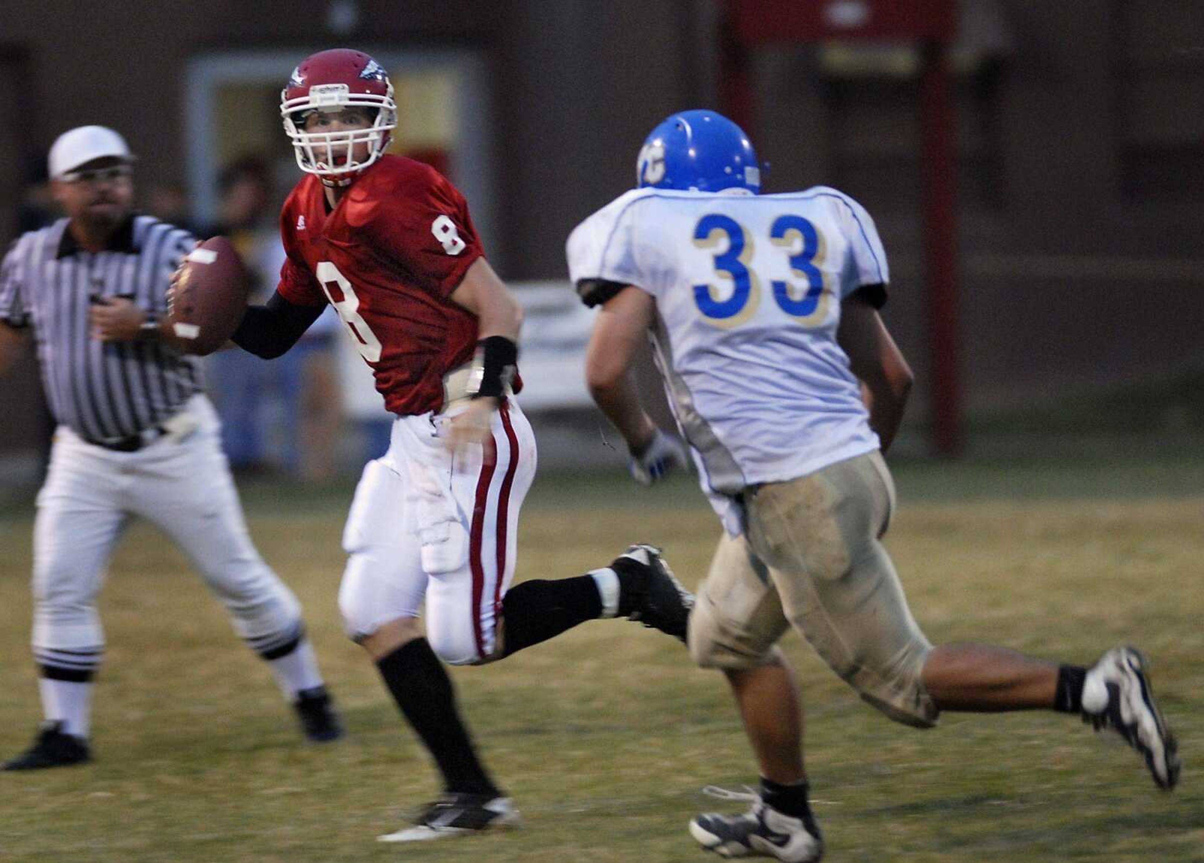 Jackson quarterback Bobby Clark looks for his options as North County's Derek Mitchell approaches during the first quarter of a game on Friday, Sept. 10, 2010, in Jackson. Jackson defeated North County 17-0. (Kristin Eberts)