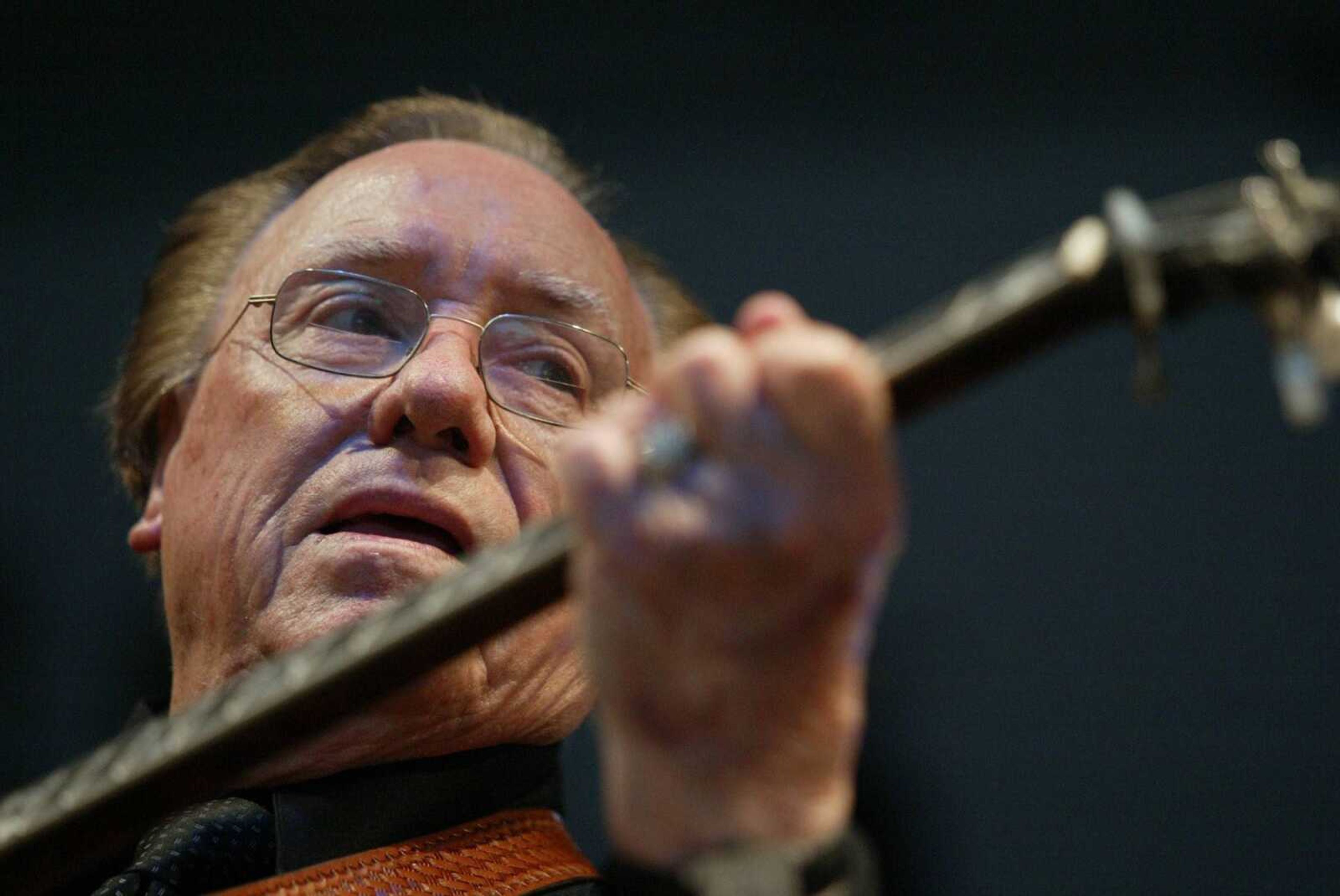 In this June 10, 2005 file photo, Earl Scruggs, performed at the Bonnaroo Music & Arts Festival in Manchester, Tenn. Scruggs' son Gary said his father passed away Wednesday at a Nashville, Tenn., hospital of natural causes. He was 88. (AP Photo/Eric Parsons, File)