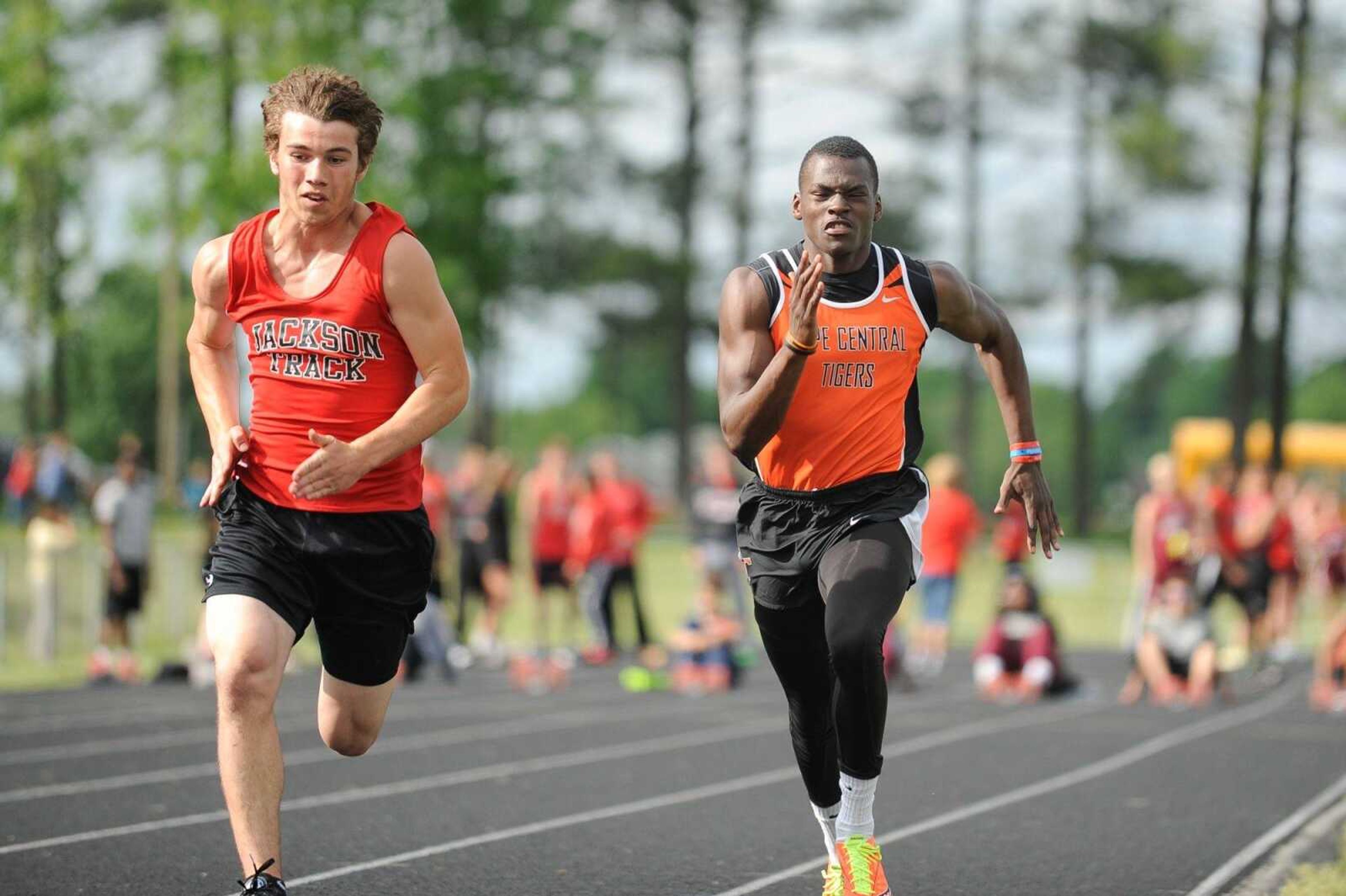 Jackson's Ethan Laster and Cape Central's Jordan Franklin make their way down the track in the 100-meter open race at the SEMO Conference North track and field meet Friday, May 8, 2015 in Jackson. (Glenn Landberg)