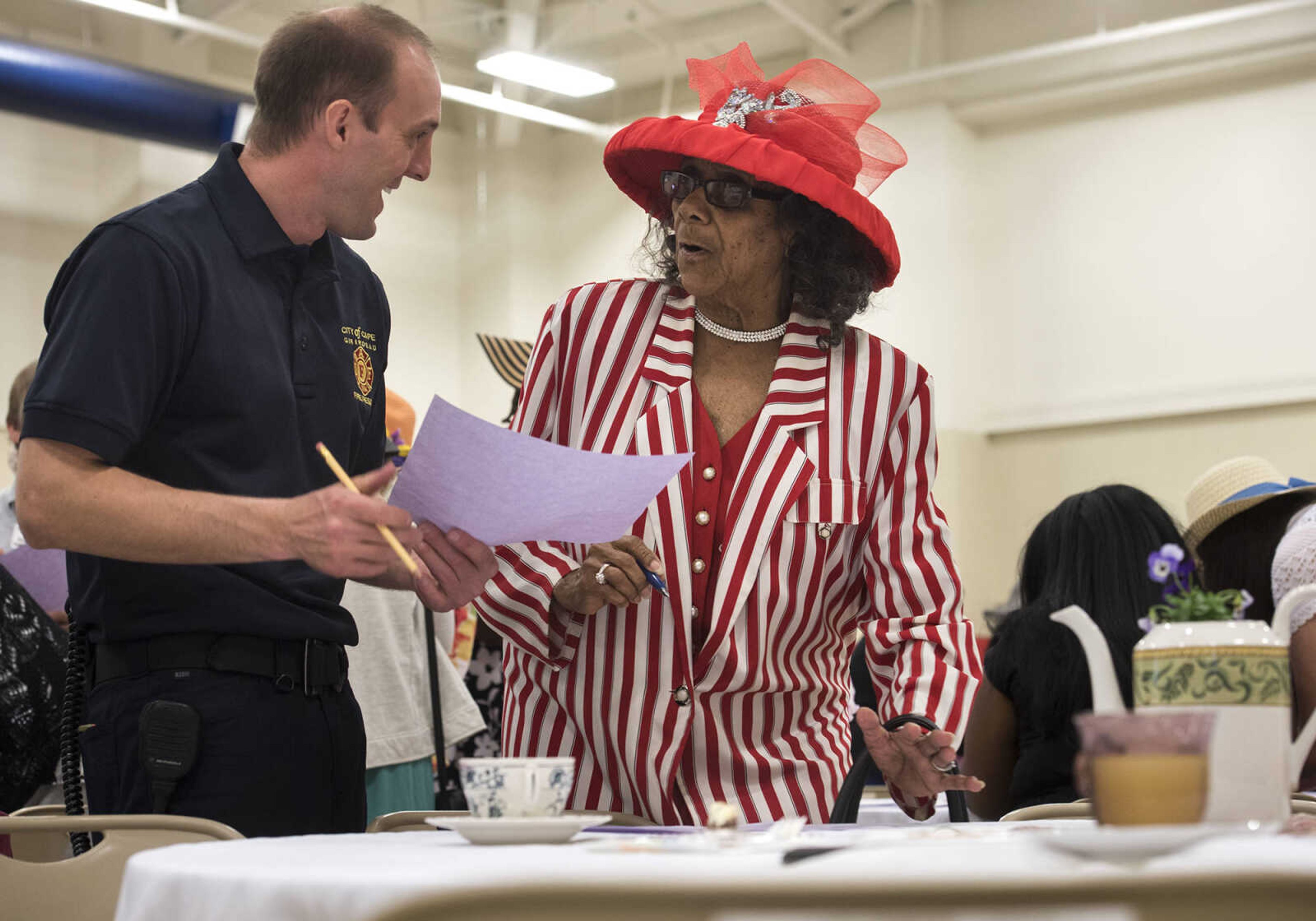 Justin Drury and Martha Wilson socialize during an icebreaker at a tea and sweets event hosted by Stop Needless Acts of Violence Please on April 1, 2017 at the Shawnee Park Center in Cape Girardeau.