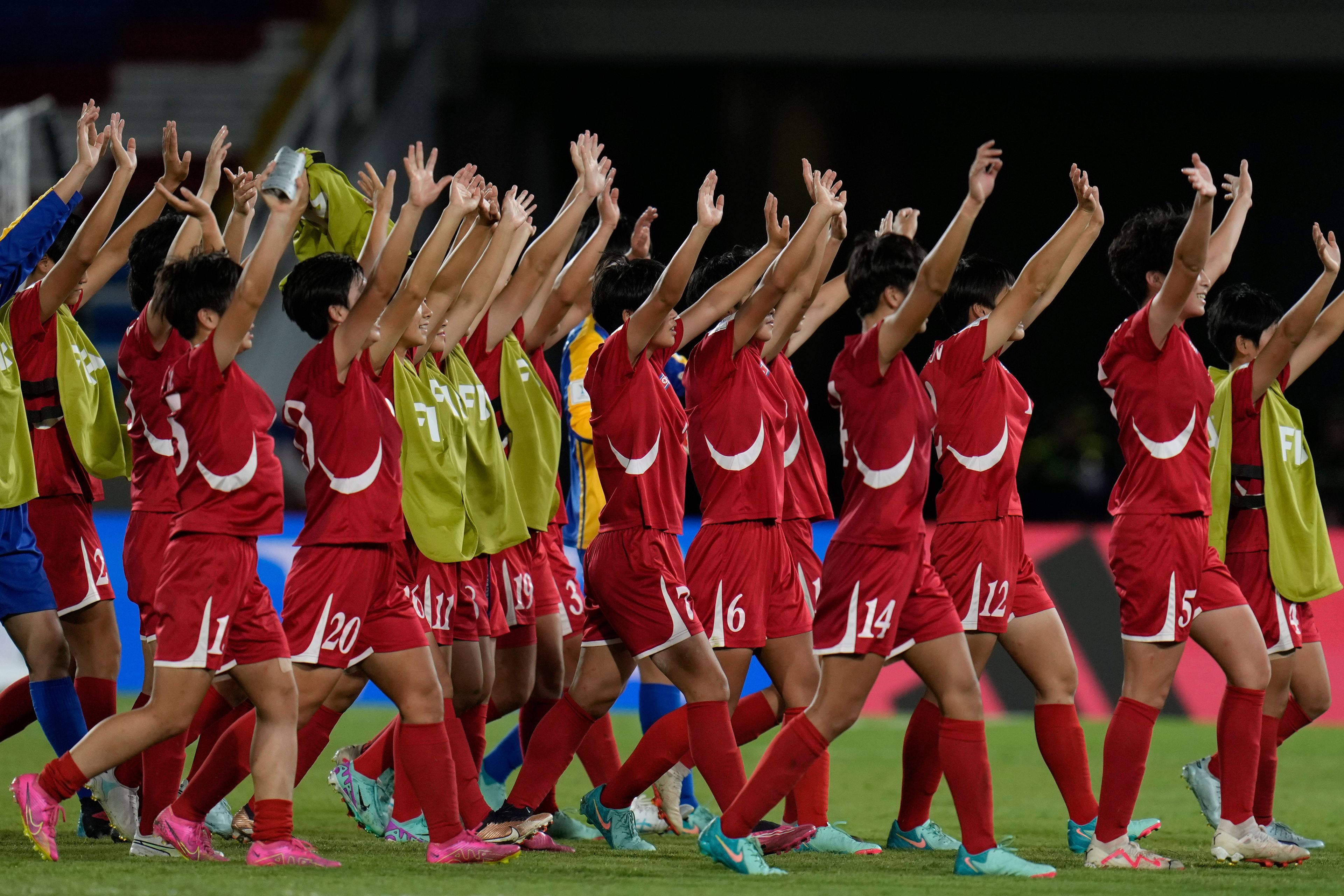 Players of North Korea walk off the field after defeating the United States in a U-20 Women's World Cup semifinal soccer match in Cali, Colombia, Wednesday, Sept. 18, 2024. (AP Photo/Fernando Vergara)