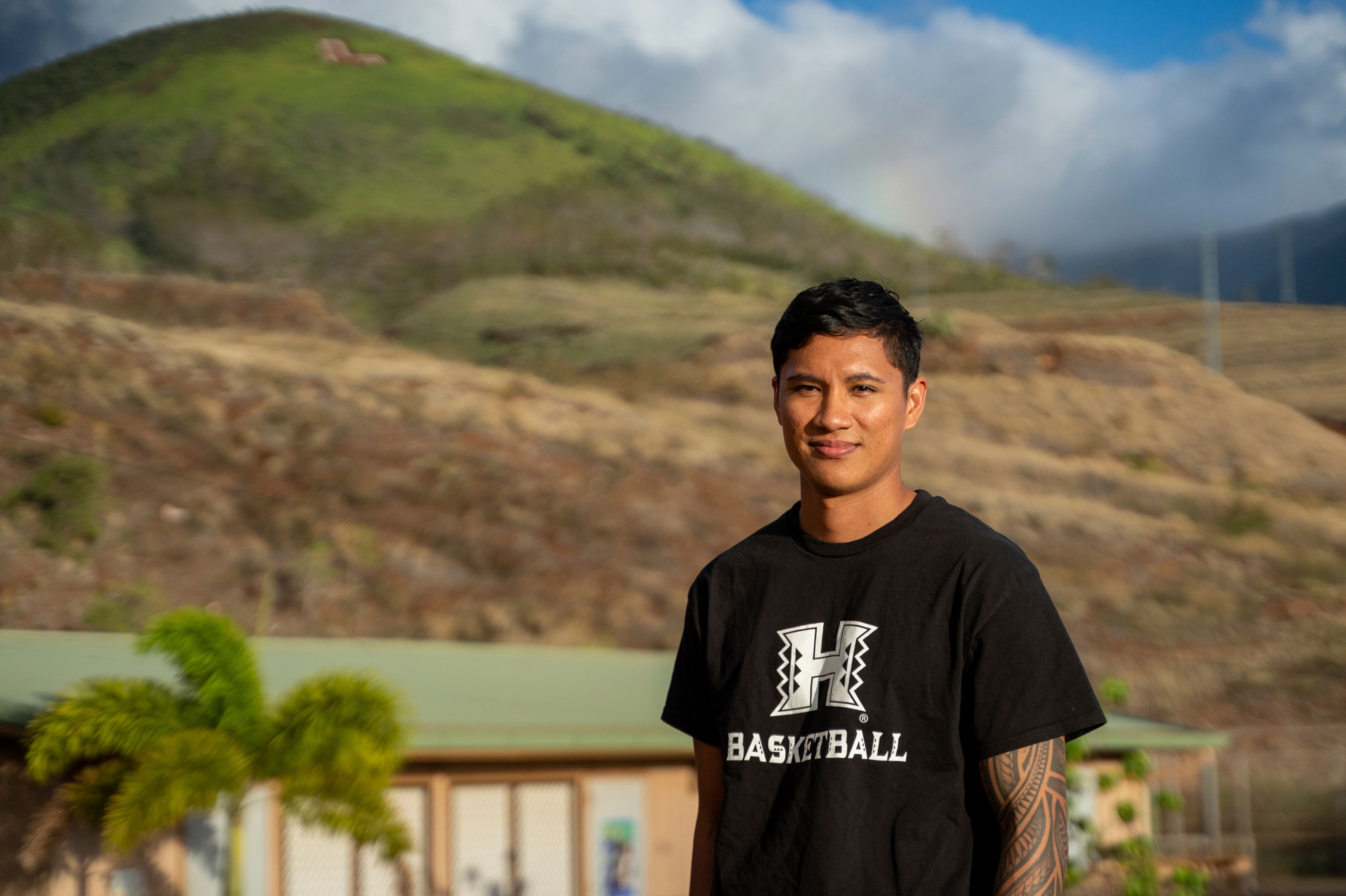 TJ Rickard, Lahainaluna High School boys basketball coach, poses for a portrait at Lahainaluna High School, Monday, Nov. 18, 2024, in Lahaina, Hawaii. (AP Photo/Mengshin Lin)