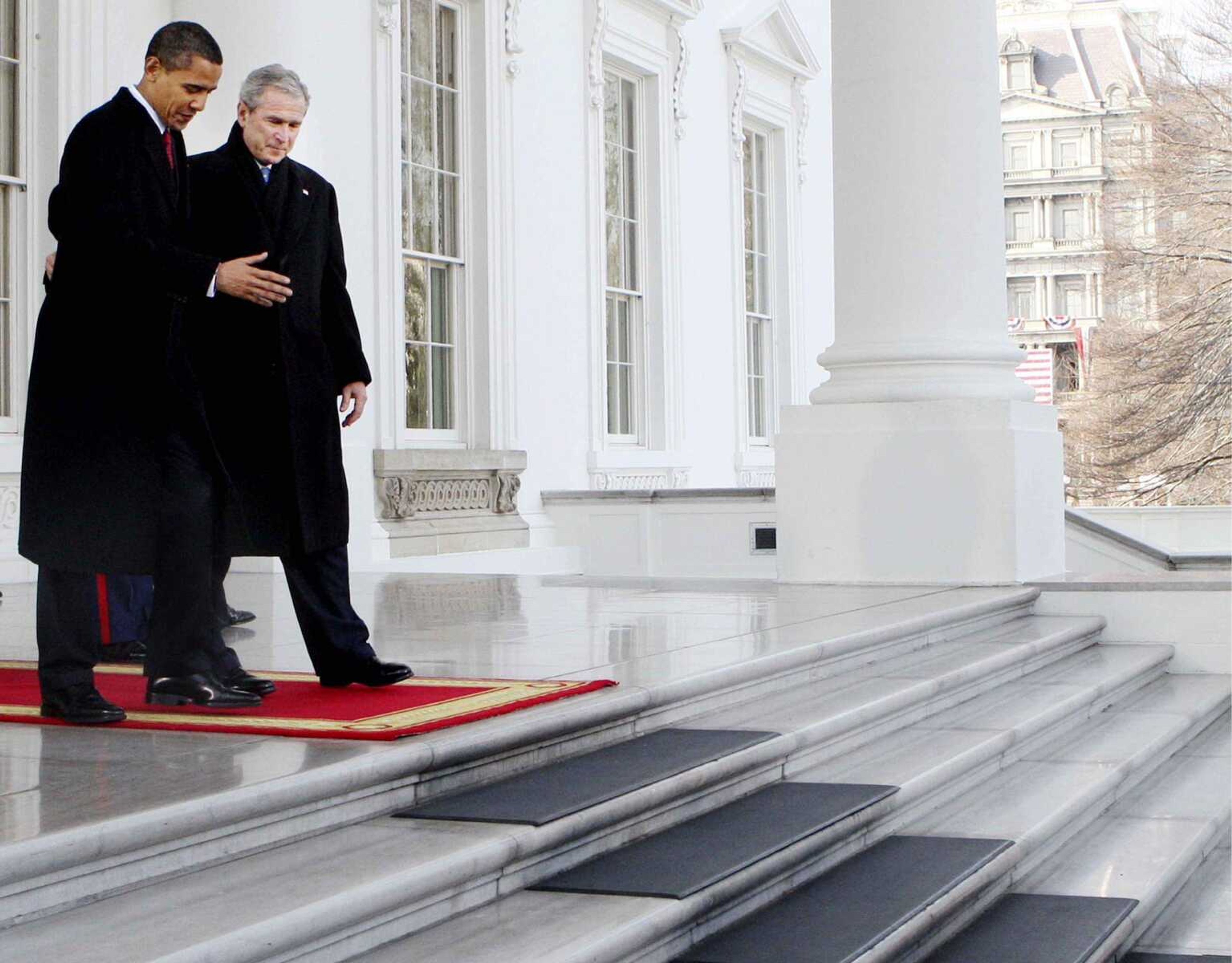 President Bush, right, walks out with President-elect Barack Obama, on the North Portico of the White House before sharing the presidential limousine enroute to Capitol Hill for inauguration in Washington, Tuesday, Jan. 20, 2009. (AP Photo/Pablo Martinez Monsivais)