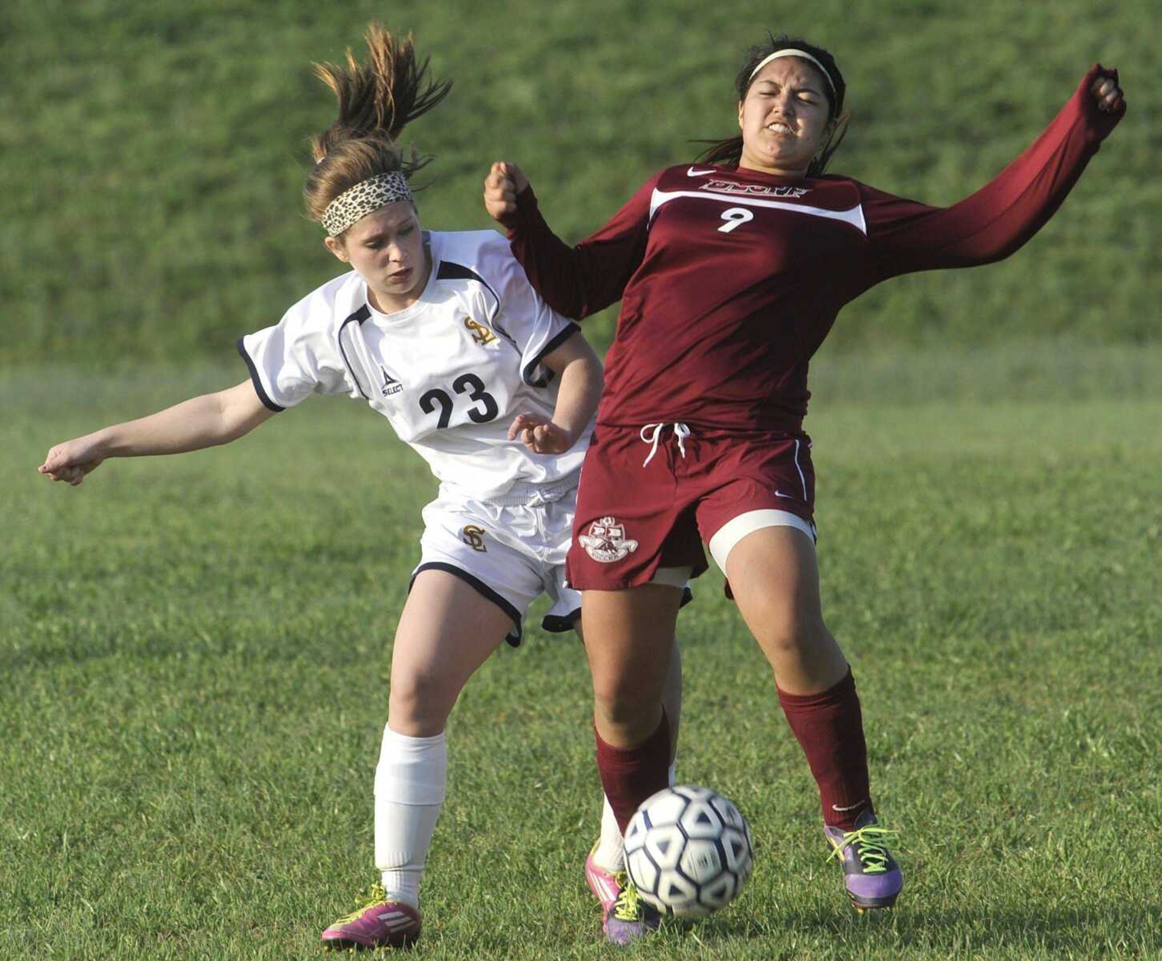 Saxony Lutheran&#8217;s Tess Daniel battles Poplar Bluff&#8217;s Kayce Kimbrow for ball possession during the second half.