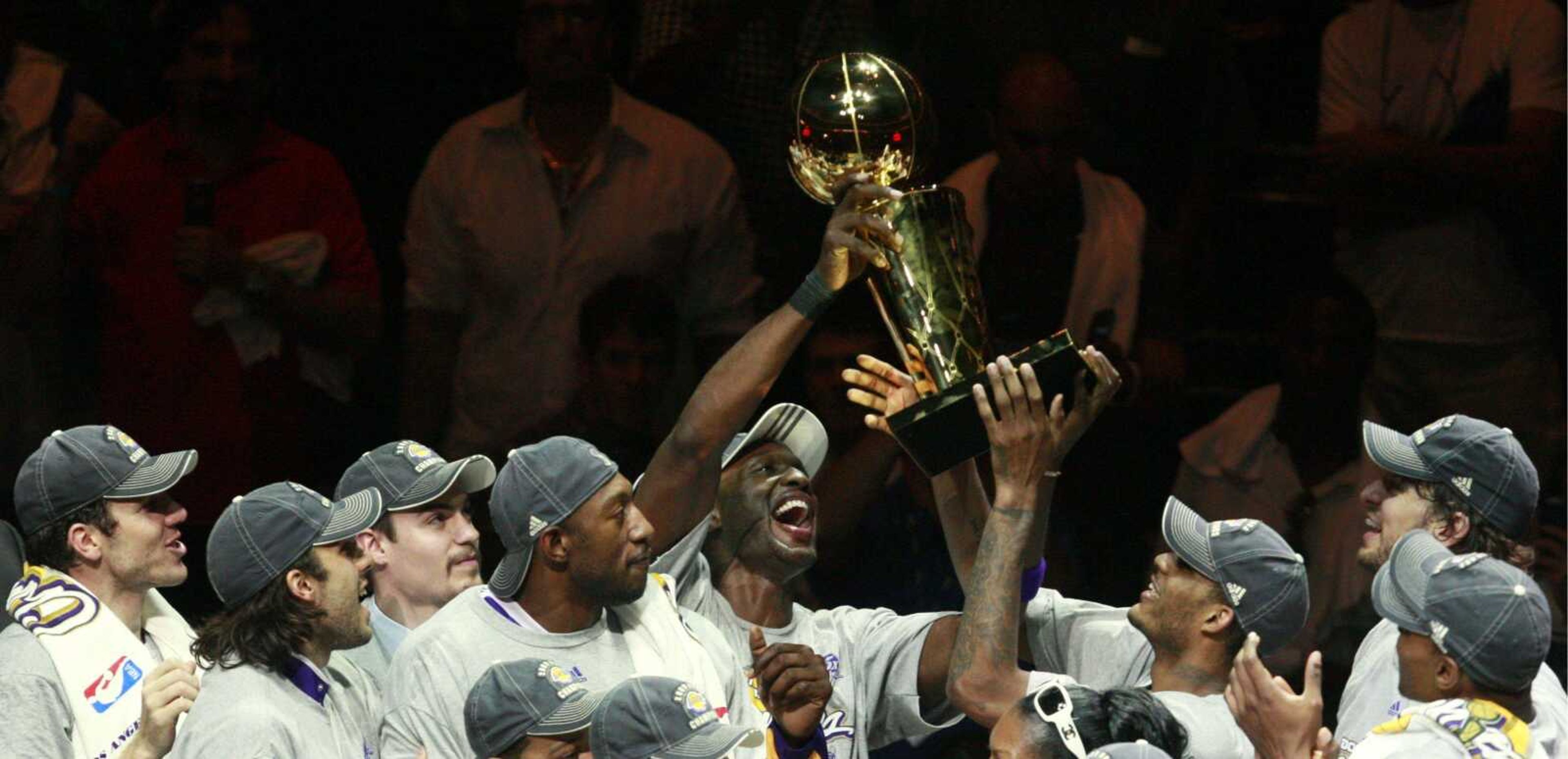 LEFT: Looters take goods from a shoe store in downtown Los Angeles. (ABOVE: Los Angeles Lakers players pass around the trophy after winning the NBA title in Orlando, Fla.)