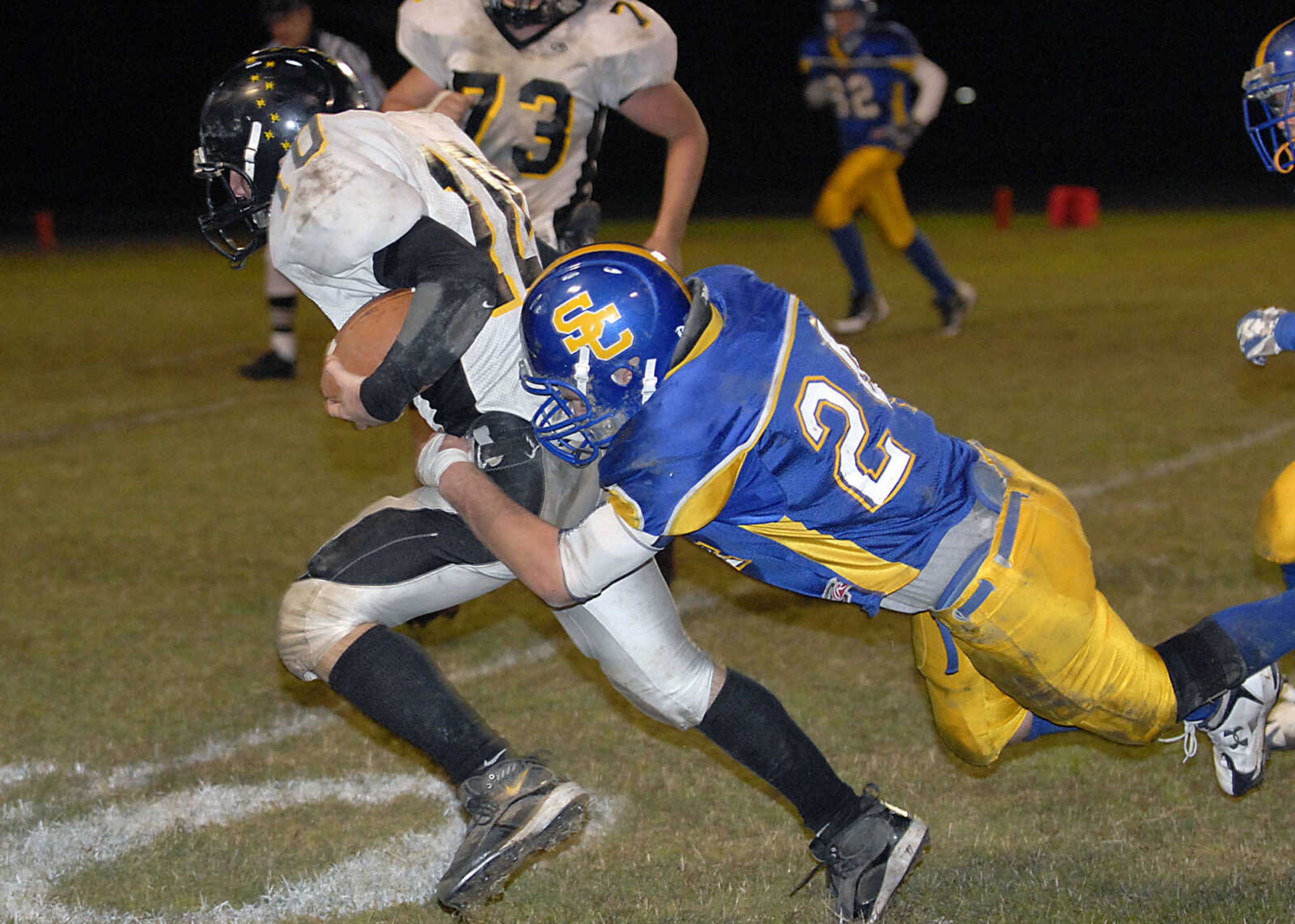 KIT DOYLE ~ kdoyle@semissourian.com
Scott City defender Hunter Griffith pulls down Grandview running back Robby Allen Friday, October 16, 2009, in Scott City.