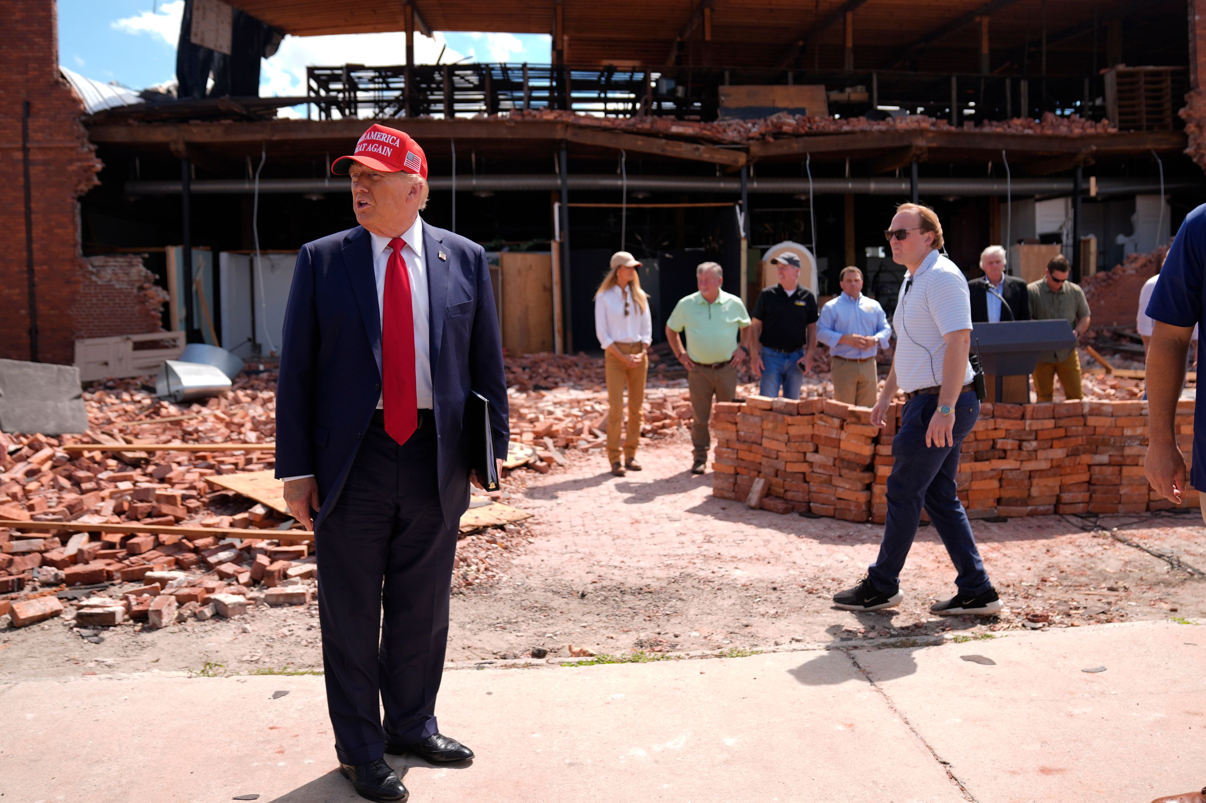 Republican presidential nominee former President Donald Trump tours downtown Valdosta, Ga., a town that was impacted by Hurricane Helene, Monday, Sept. 30, 2024. (AP Photo/Evan Vucci)