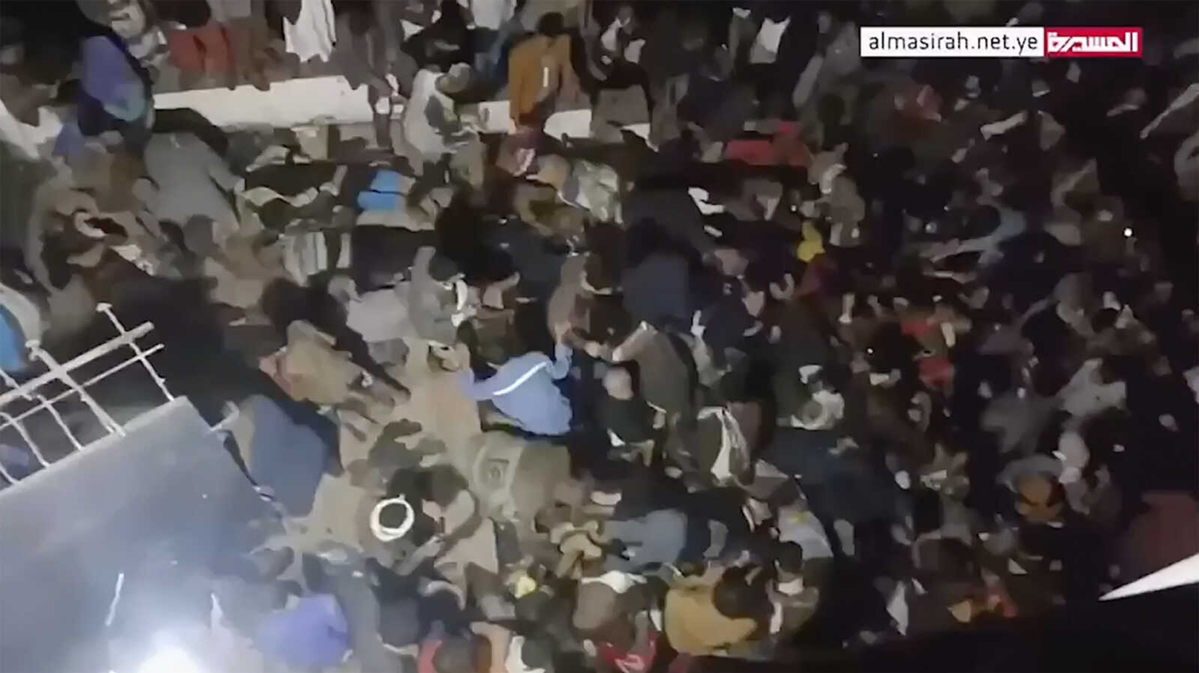 This image from a video, shows the scene of a deadly stampede in Sanaa, Yemen Wednesday. A crowd apparently spooked by gunfire and an electrical explosion stampeded at an event to distribute financial aid during the Muslim holy month of Ramadan in Yemen's capital late Wednesday.