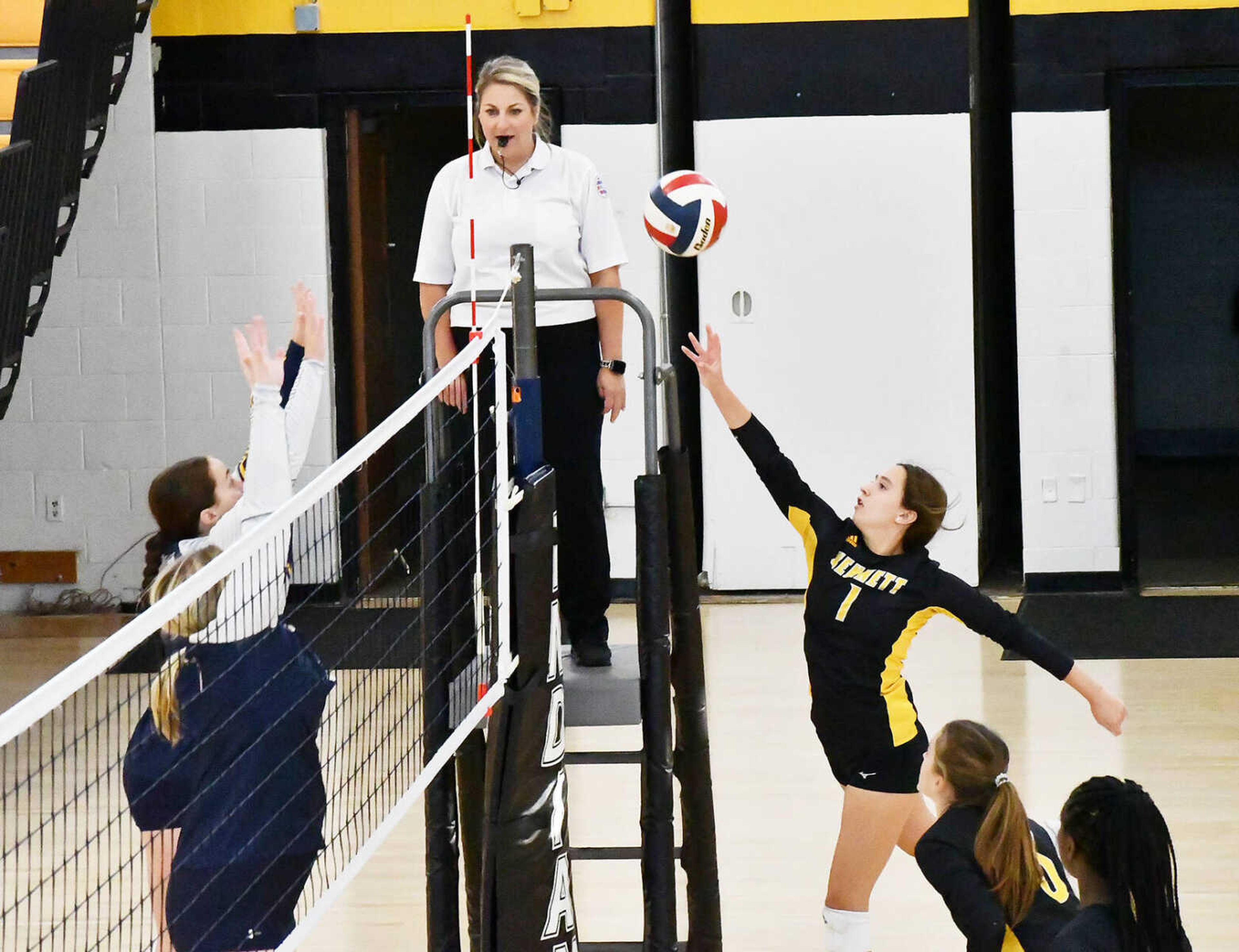 Kennett sophomore defensive specialist Kynsly McCaig (1) sends a free ball over the net during a match on Monday, Oct. 9, versus Saxony Lutheran. The Indians extended the Crusaders to four sets before ultimately falling by scores of 25-10, 19-25, 25-7, 25-17. 