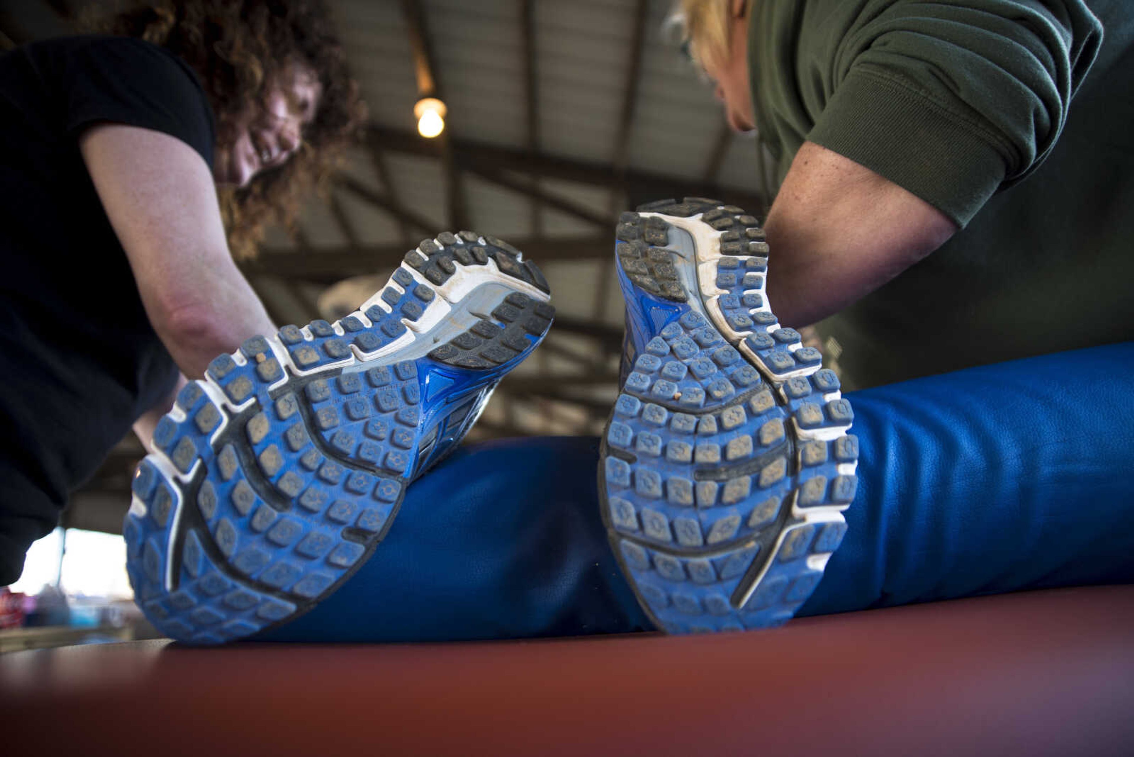 Lisa Huffman-Davis and Laura Wacke massage a runner after running for the 8th annual Howard Aslinger Endurance Run on Saturday, March 18, 2017 in Cape Girardeau. The event raises money for the Howard L. Aslinger Memorial Scholarship where runners will keep running until they can't anymore with the event starting at 7 p.m. Friday night going for 24 hours until Saturday night.